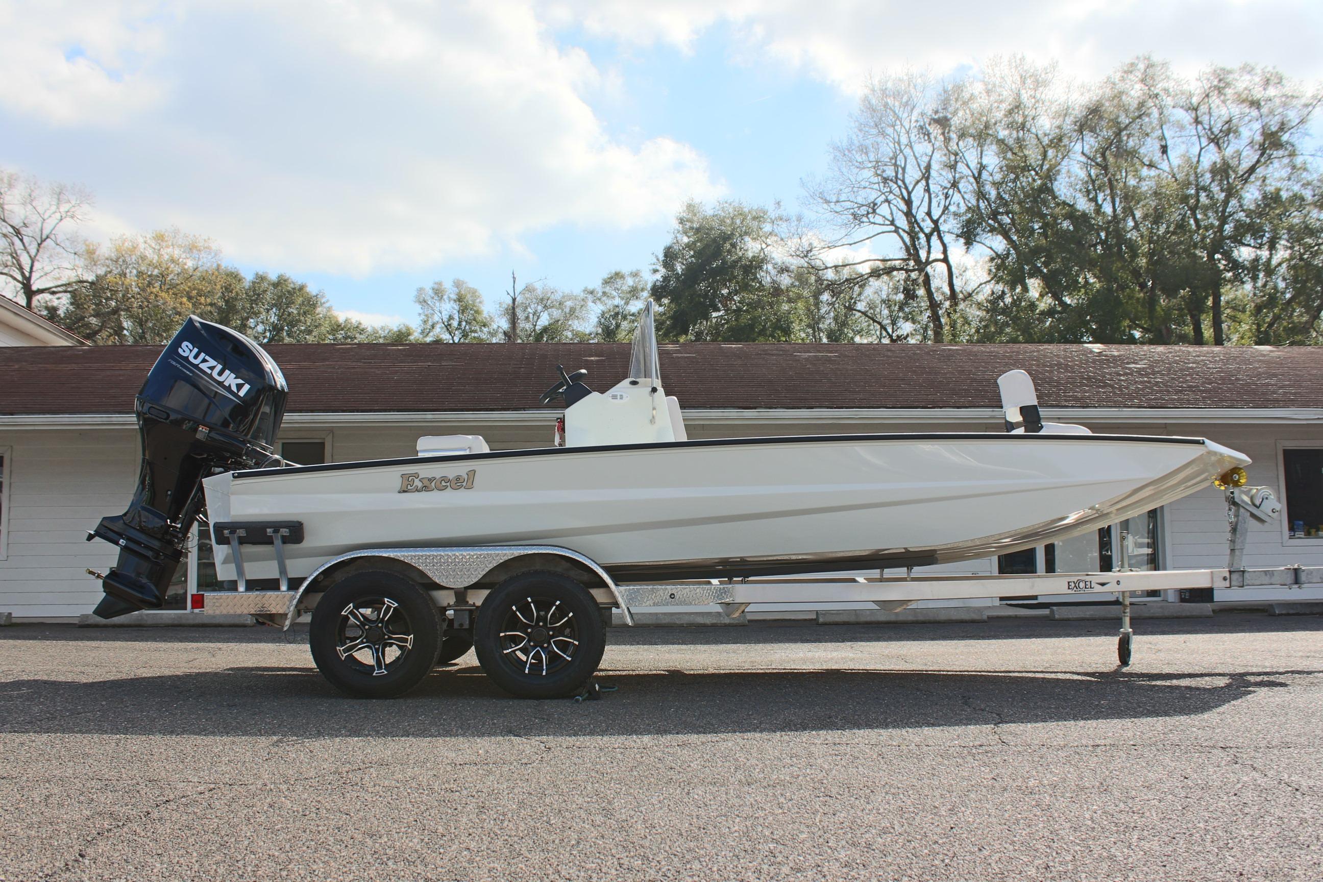 2025 Excel 2172 Stalker CC boat on trailer with Suzuki outboard motor.