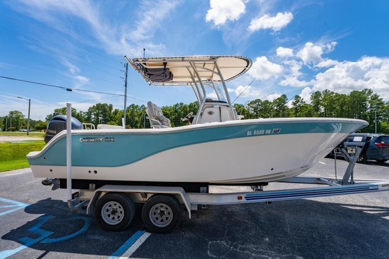 2021 Sea Fox 228 Commander boat on trailer under clear blue sky.