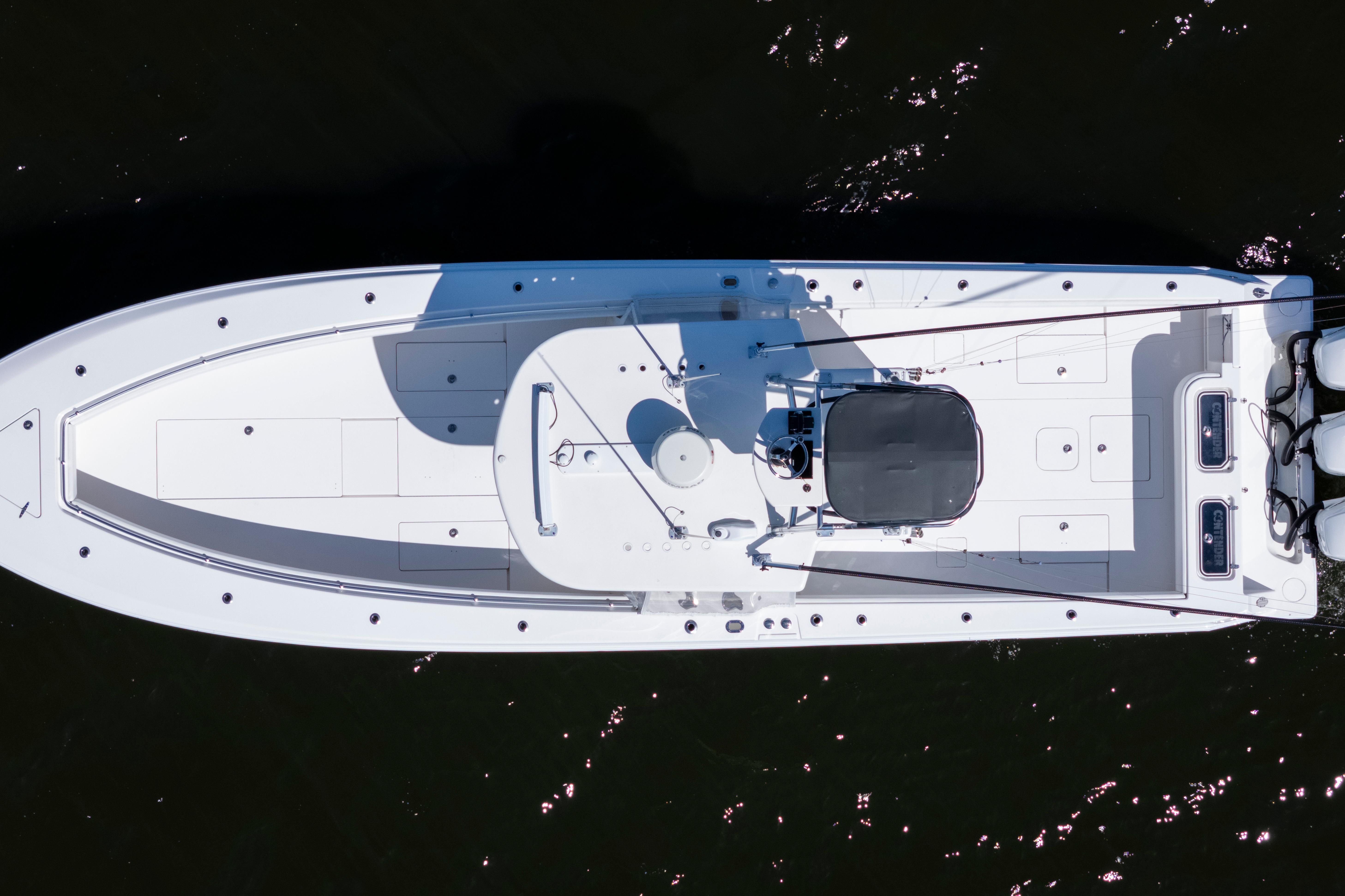 Overhead view of 2015 Contender 39 ST boat on dark water.