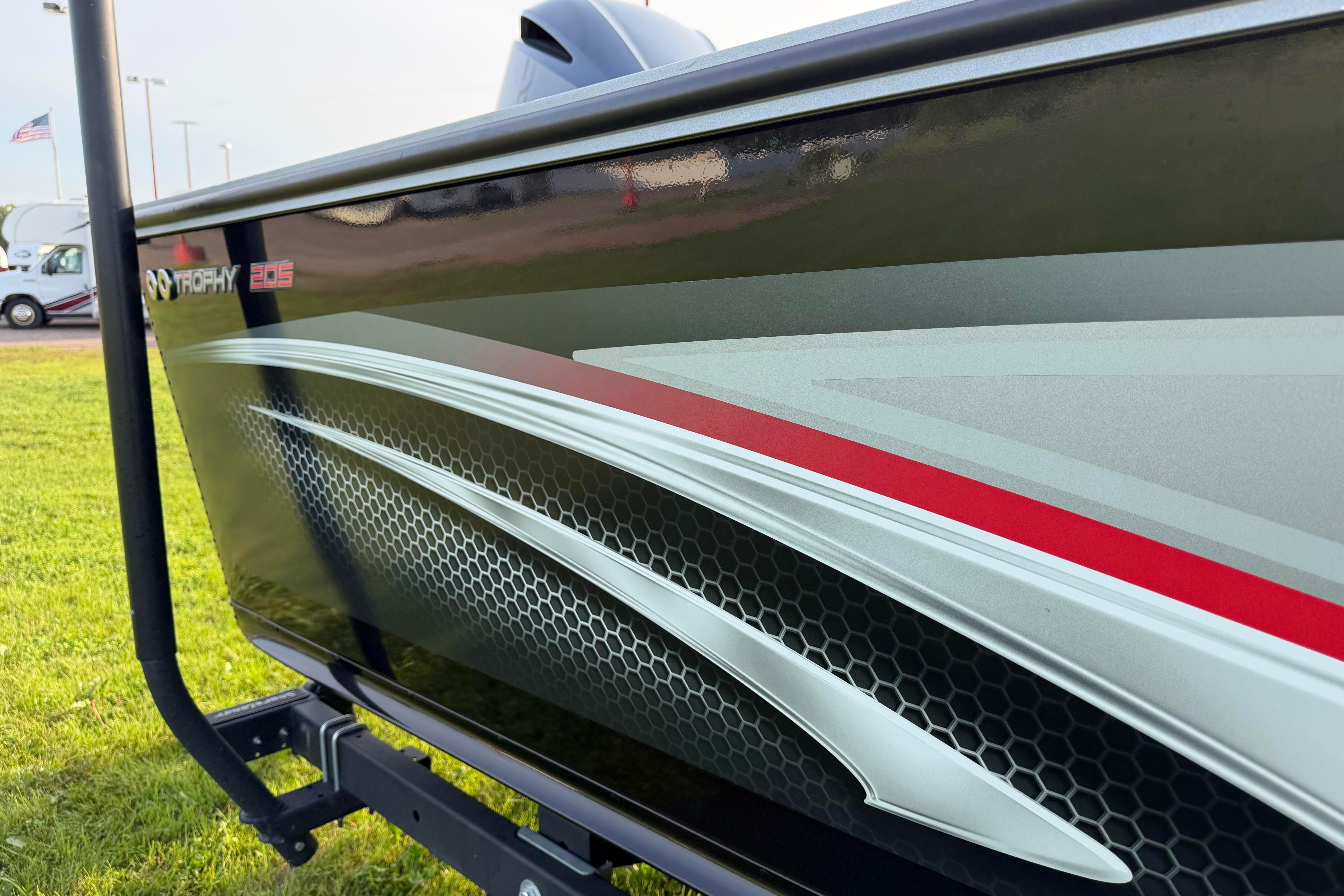 2019 Alumacraft Trophy 205 boat with sleek design and graphics on display.