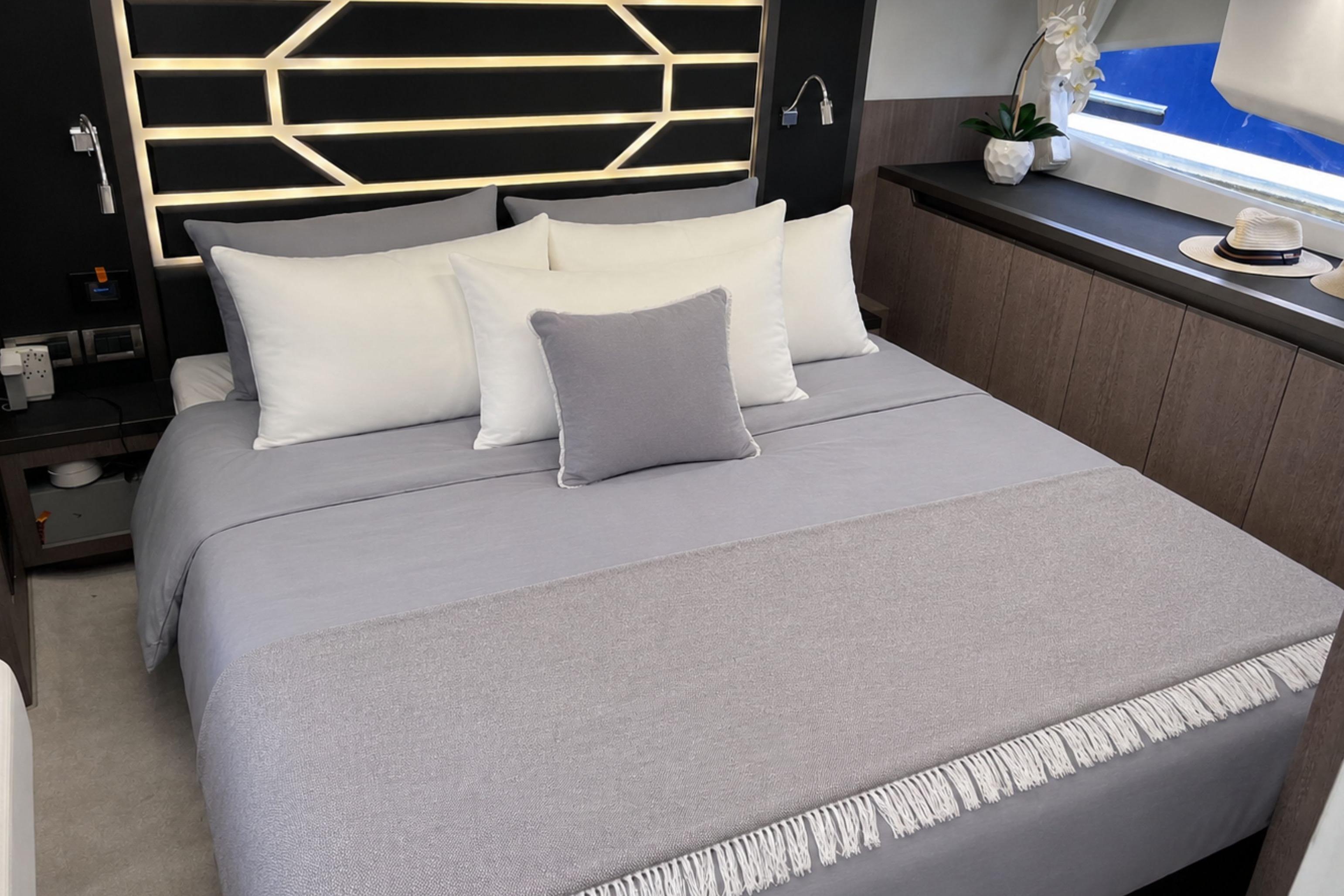 Luxurious bedroom interior of 2024 Galeon 425 HTS yacht with modern decor.