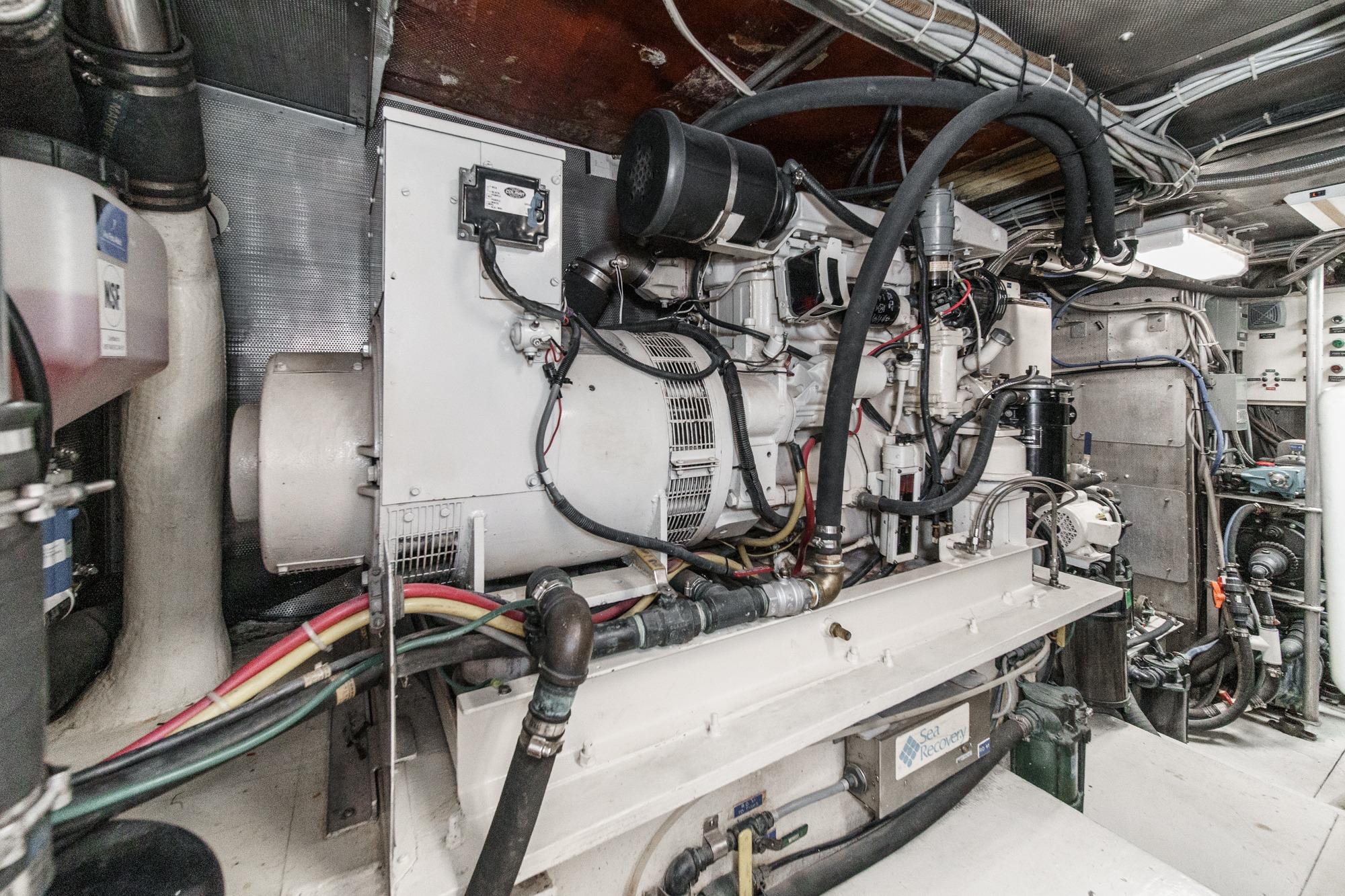 Engine room of a 1990 Seaton Long Range Cruiser with complex machinery and wiring.
