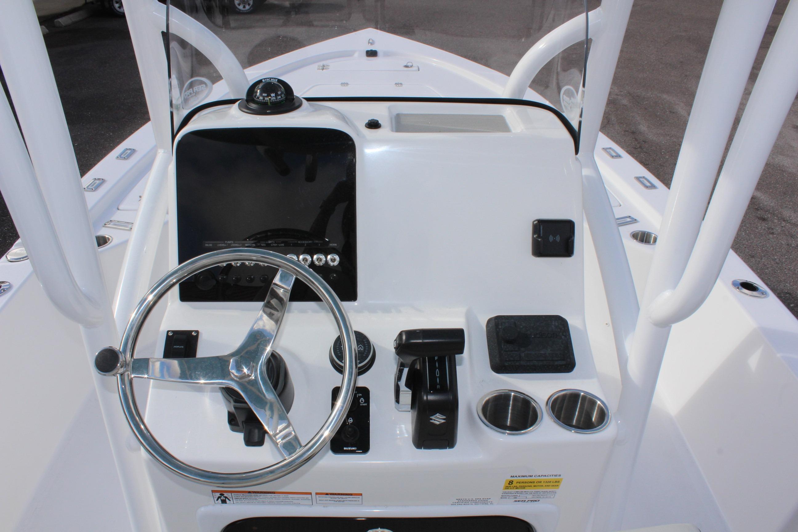 2025 Sea Pro 230 Bay boat console with steering wheel and controls.