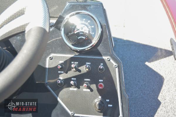 Control panel of 2024 Lowe Stinger 195 Bass boat with gauges and switches.