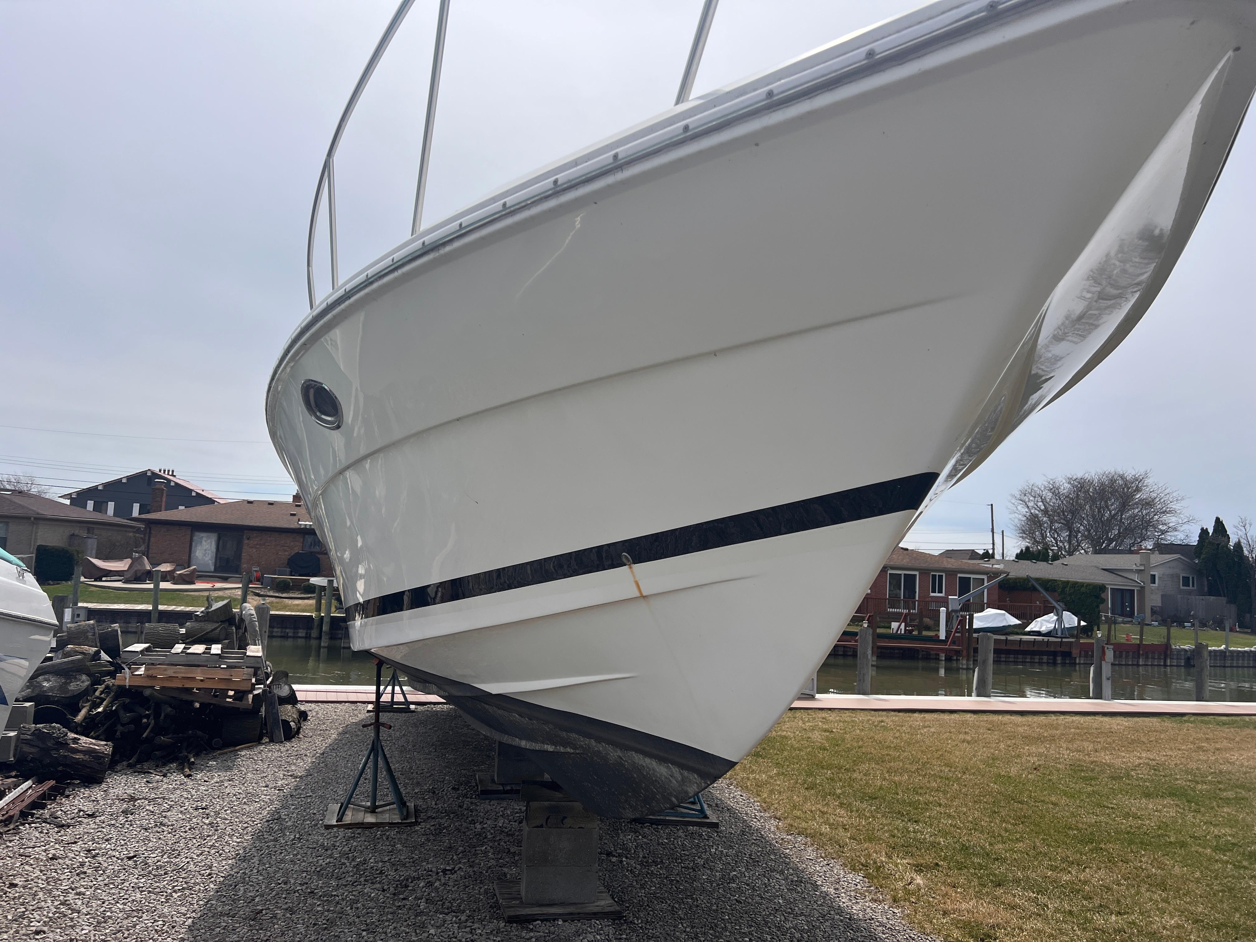 2000 Wellcraft 45 Excalibur boat on dry dock, side view.