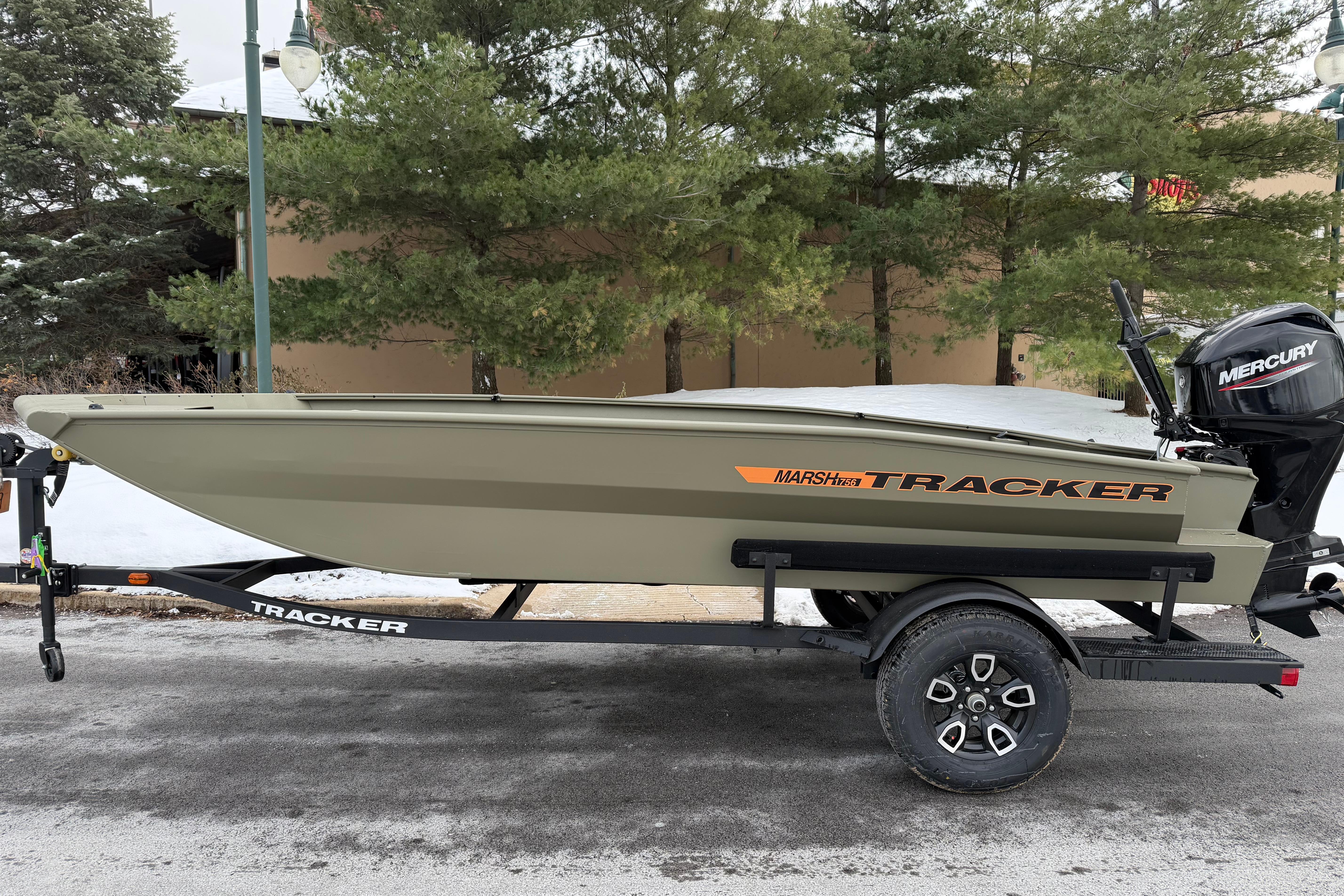 2026 Tracker Grizzly 1756 T Marsh boat on trailer, parked outdoors.