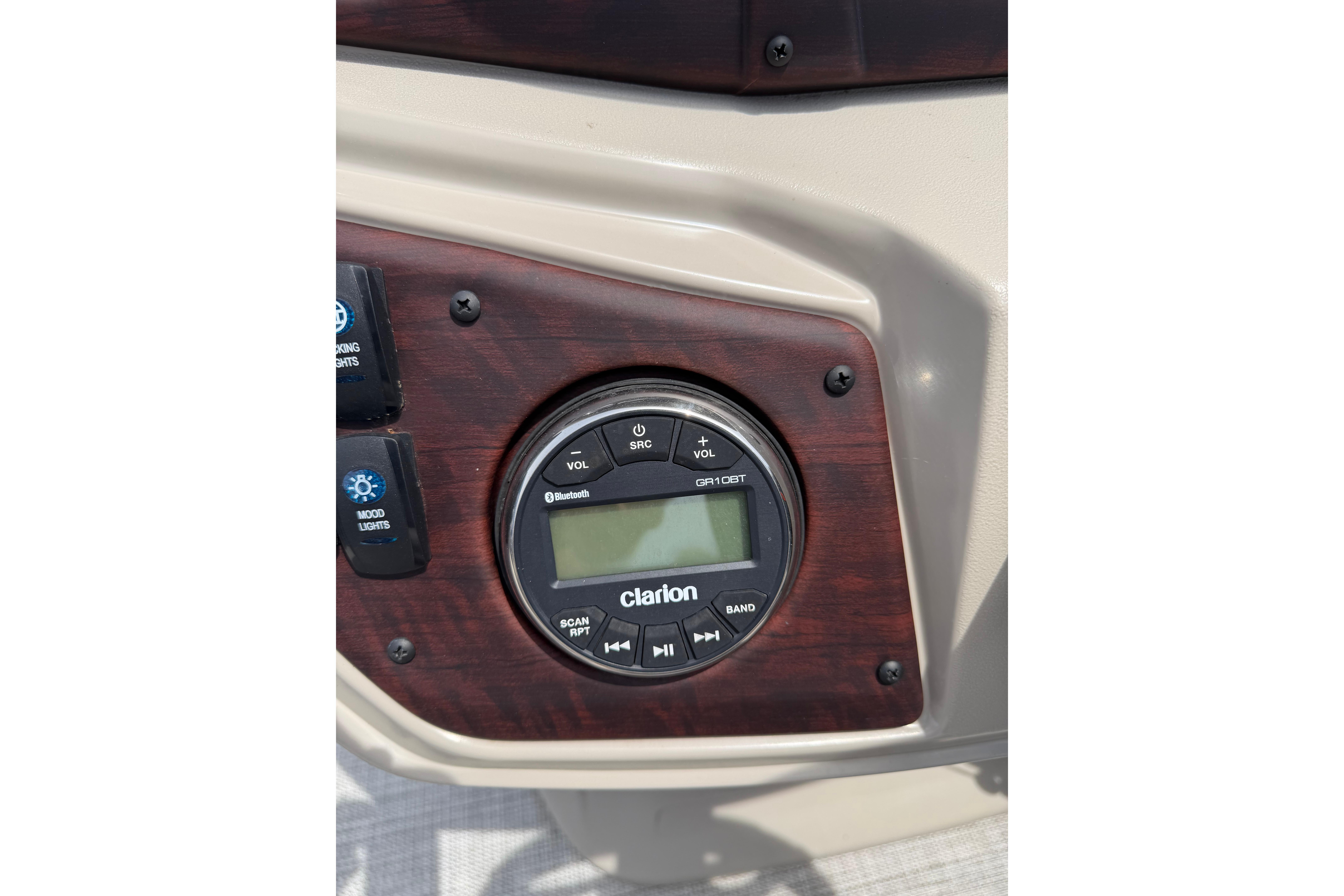 Clarion audio system on 2021 South Bay 224RS LE boat dashboard.