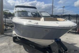 2017 Sea Ray SPX 210 Outboard boat on trailer, parked outdoors.