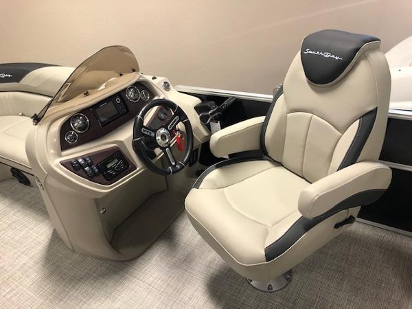 2023 South Bay 224RS LE 2.75 boat interior with captain's chair and control console.