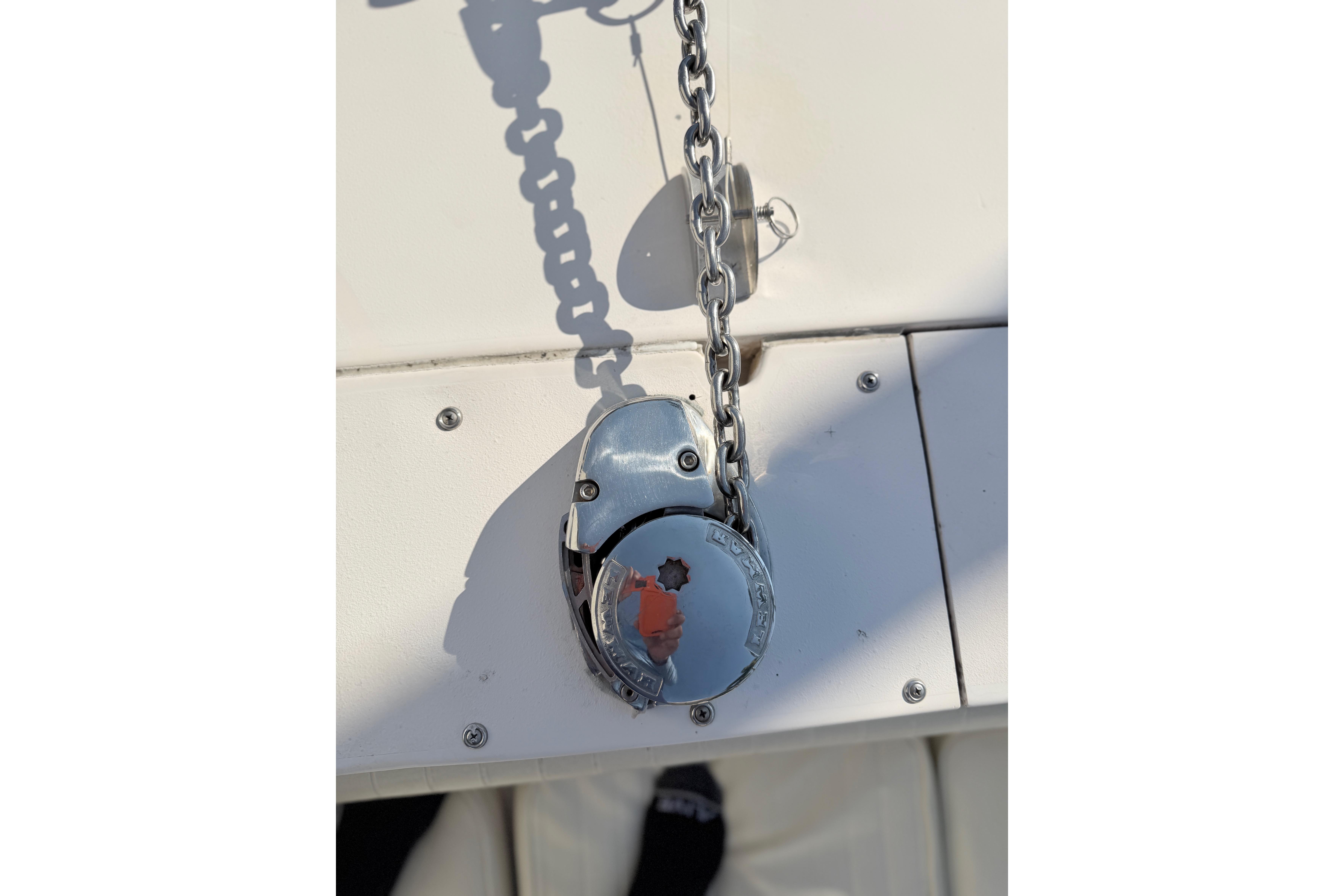 Anchor chain mechanism on 2004 Grady White 273 boat deck.