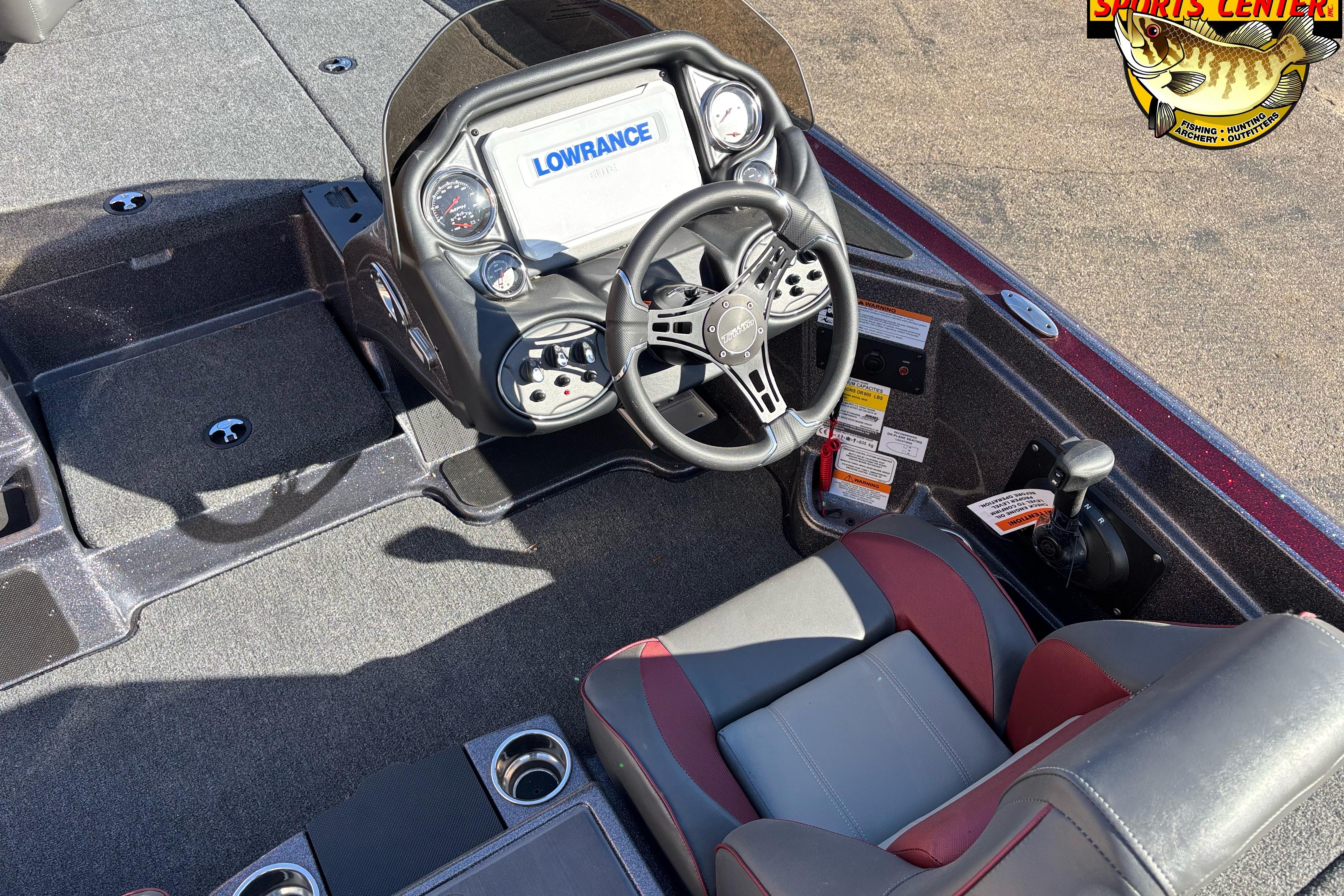 2025 Triton 18 TrX boat interior with steering wheel and Lowrance display.