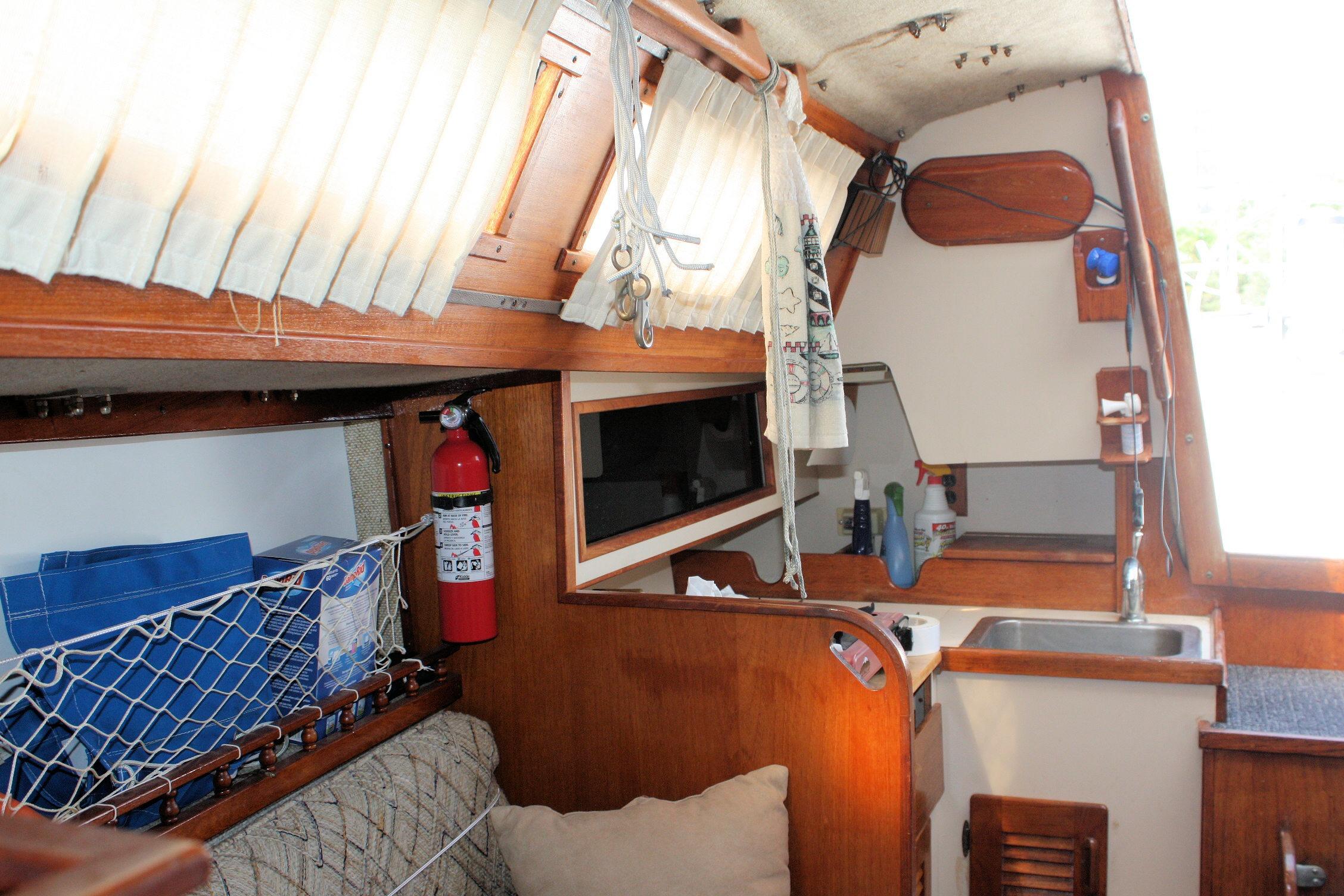 Interior of 1981 S2 9.2A sailboat with kitchenette and storage area.