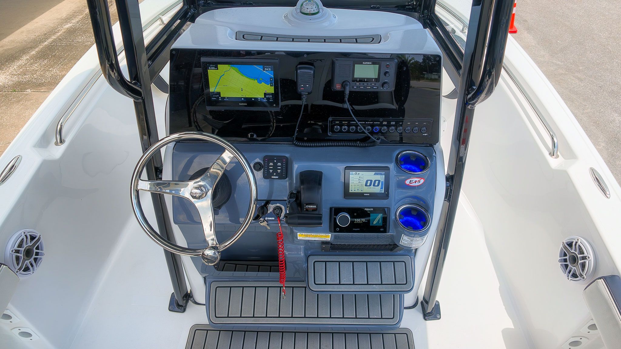 The image shows the helm of a Tidewater 198 CC Adventure boat with modern electronics.