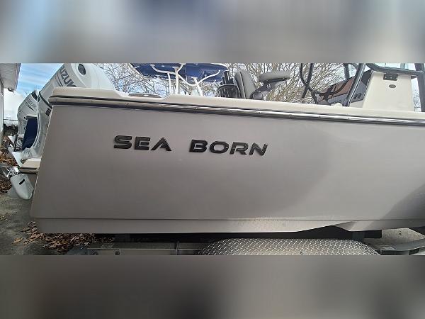 2023 Sea Born LX22 Center Console boat side view with logo.