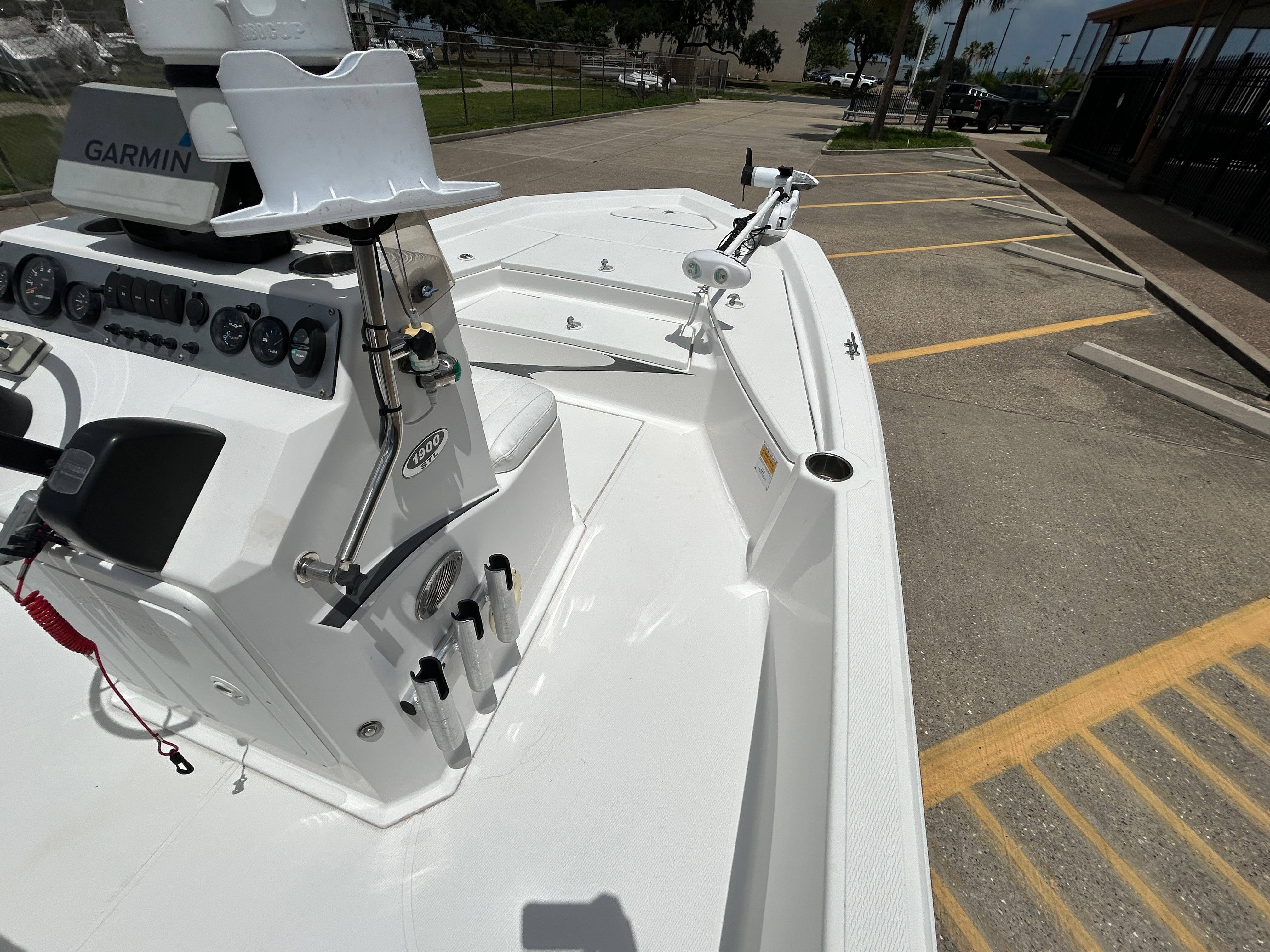 2012 Blue Wave 1900 STL boat with Garmin equipment, parked in a lot.