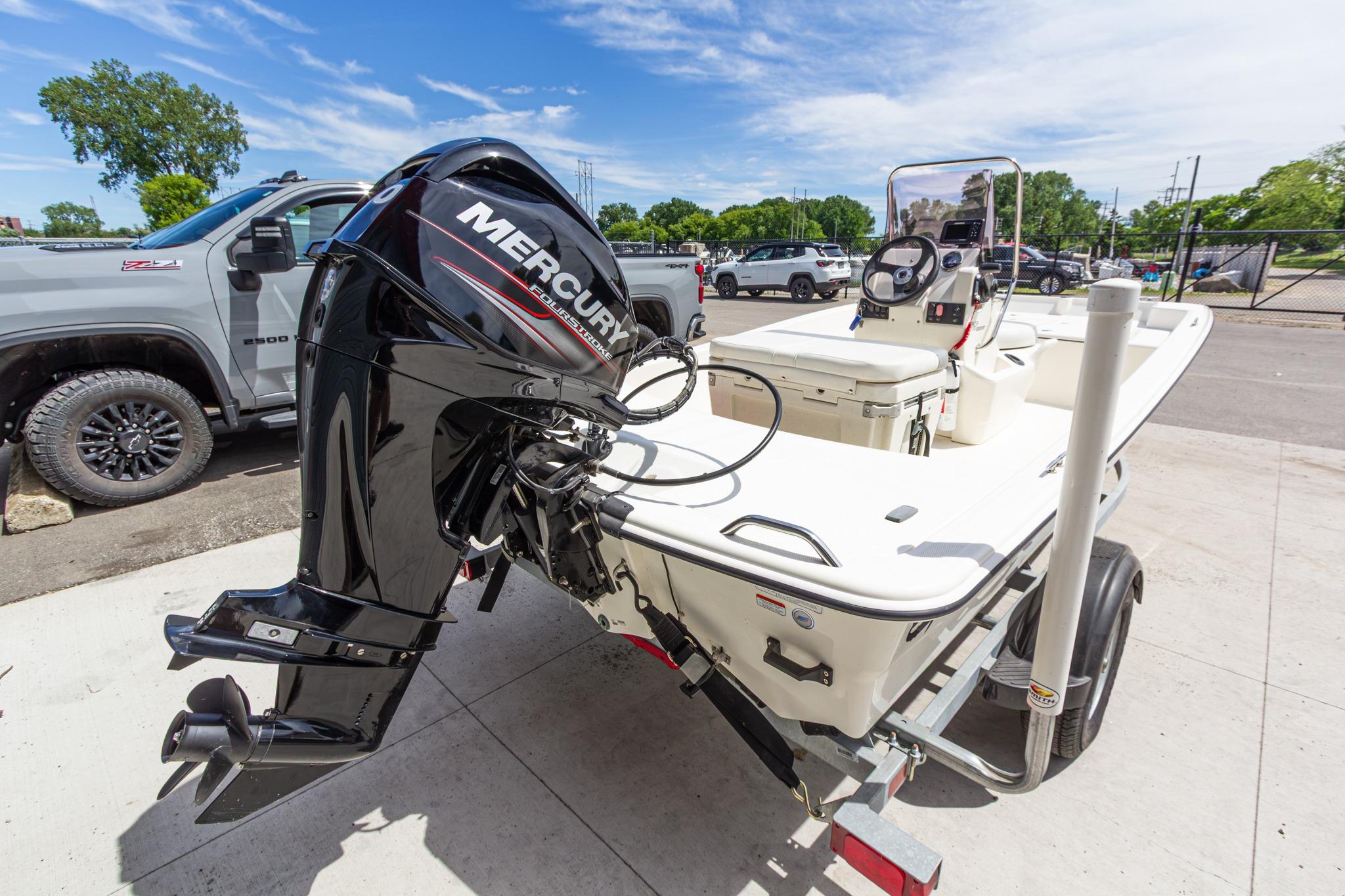 2020 Mako Pro Skiff 15 CC boat with Mercury outboard motor on trailer.