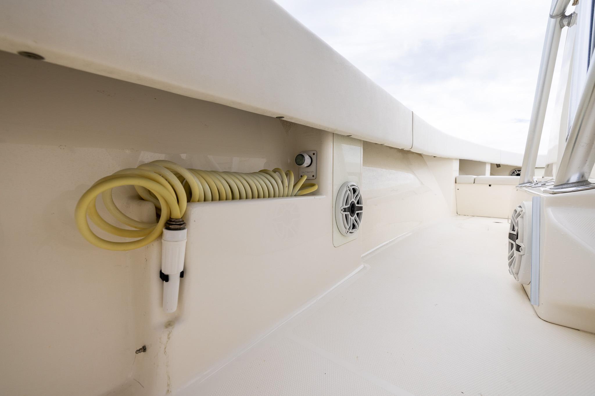 2019 SeaVee 322Z boat interior with coiled hose and speakers.