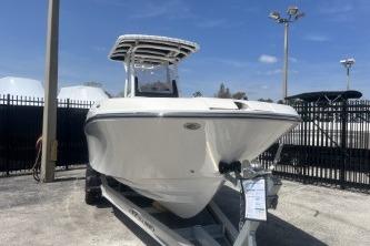 2023 Trophy T24 CC boat on trailer, displayed outdoors under clear sky.