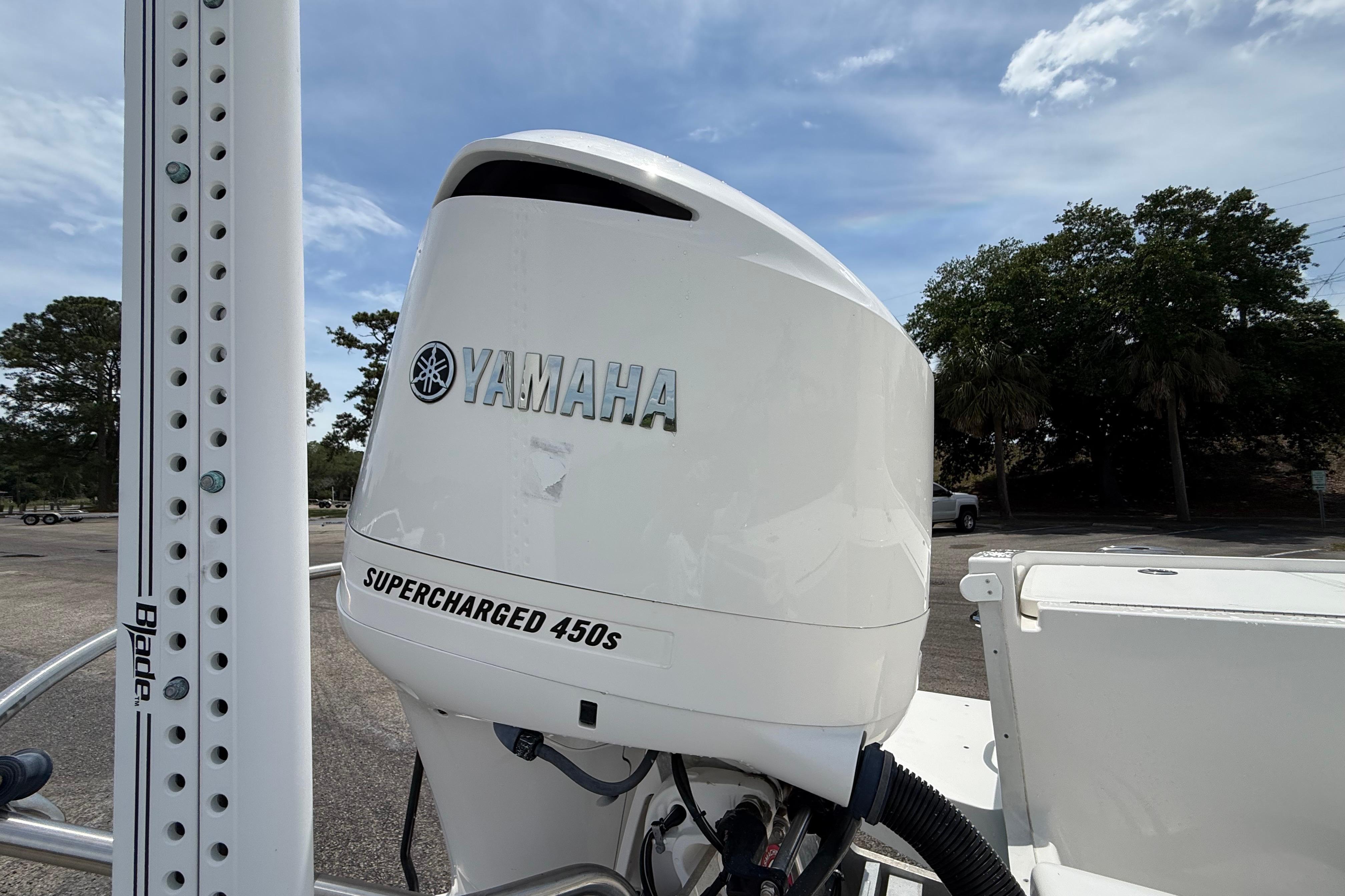 Yamaha Supercharged 450s engine on 2019 Regulator 26XO boat, parked outdoors.