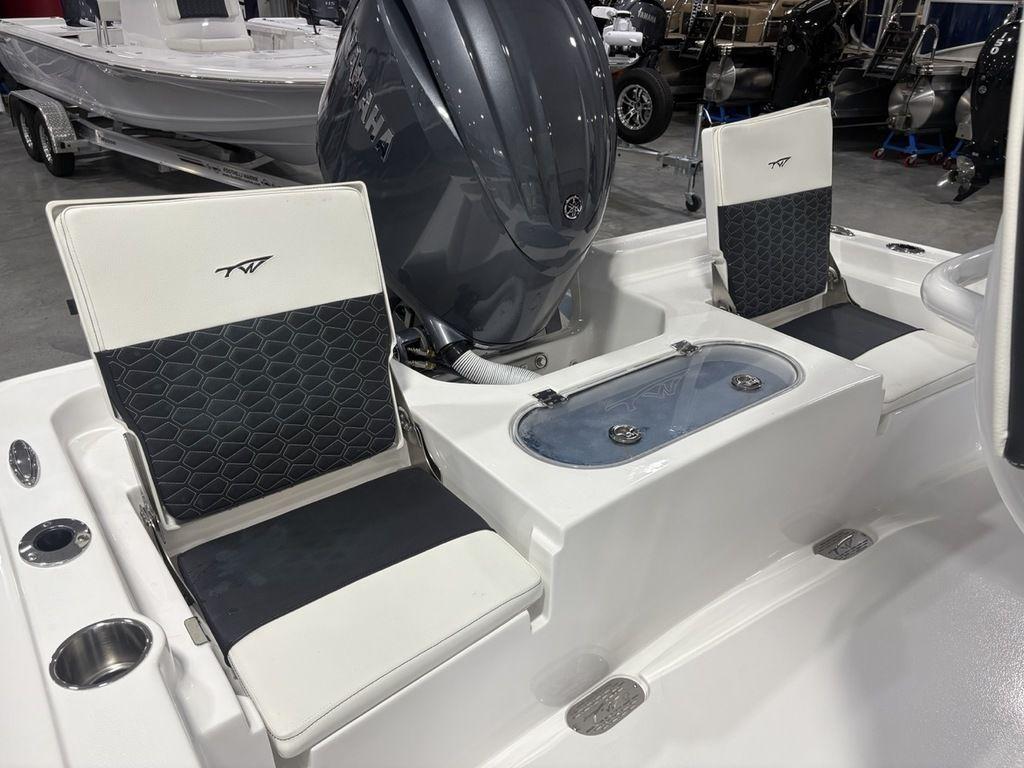 2026 Tidewater 2110 BM boat interior with seating and Yamaha engine.