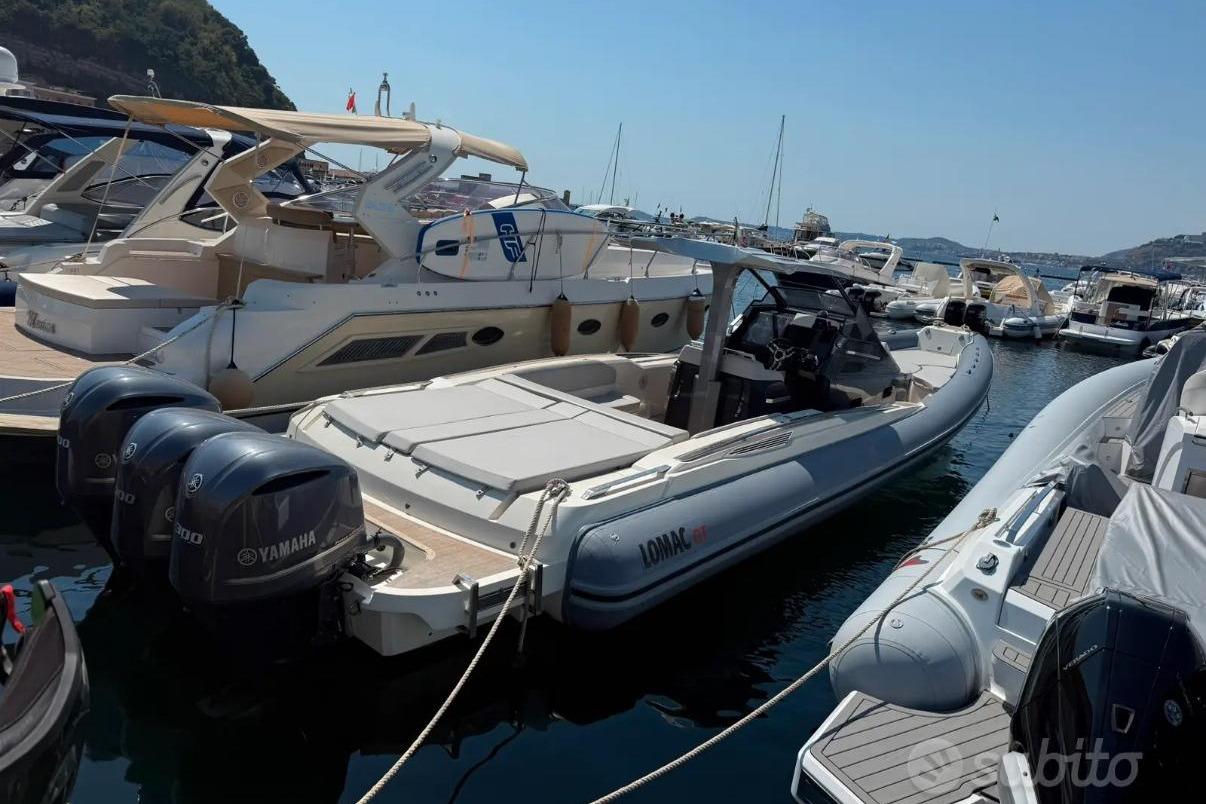 2020 Lomac GranTurismo 12.0 boat docked with Yamaha engines, surrounded by other vessels.