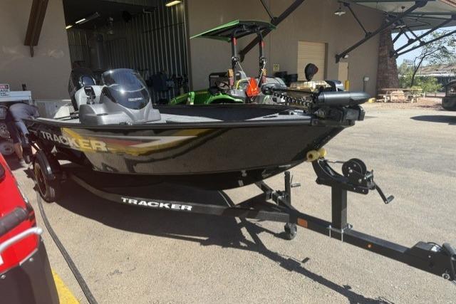 2026 Tracker Super Guide V-16 SC boat on trailer in outdoor setting.