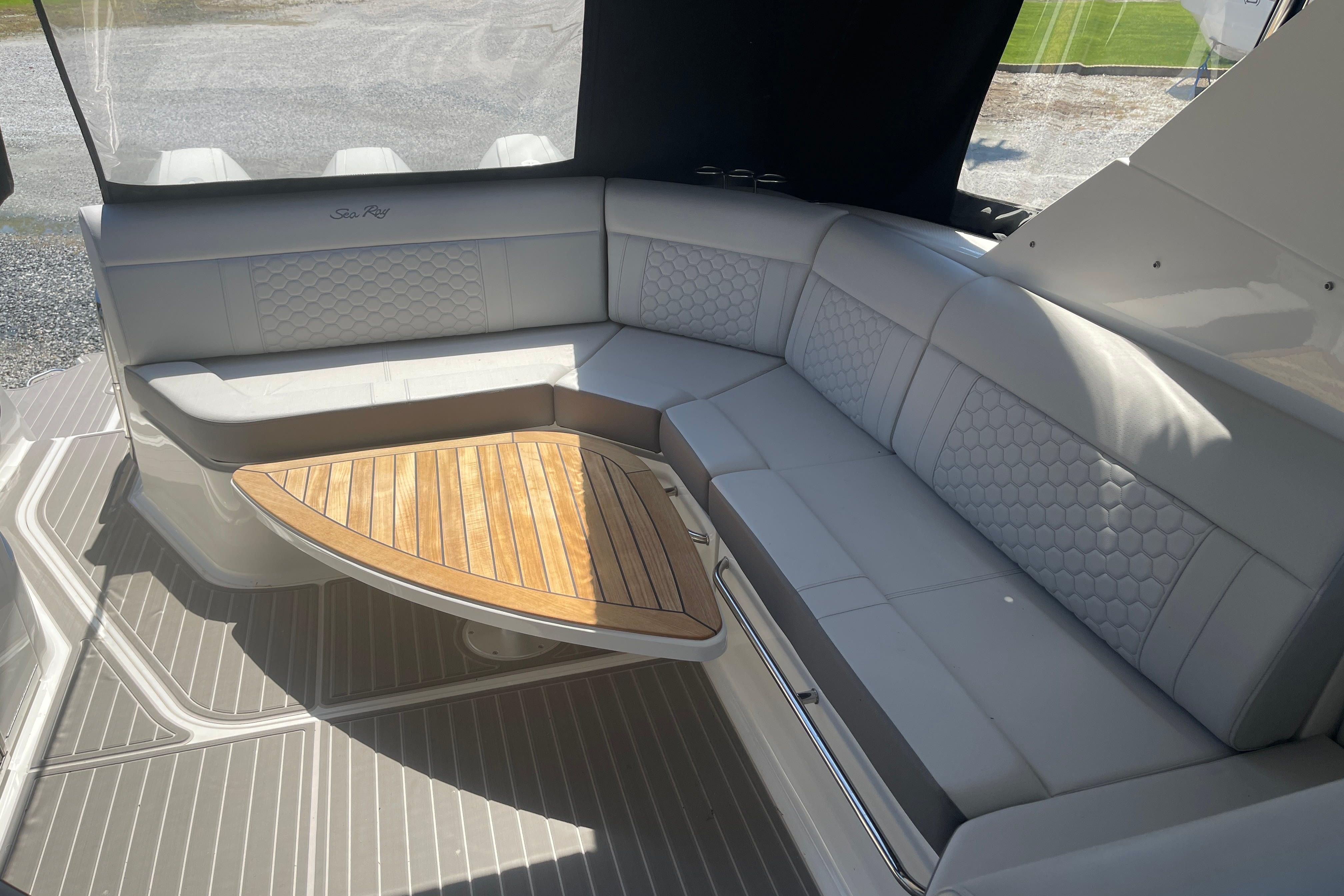 Interior of 2023 Sea Ray Sundancer 320 Outboard with elegant seating area.