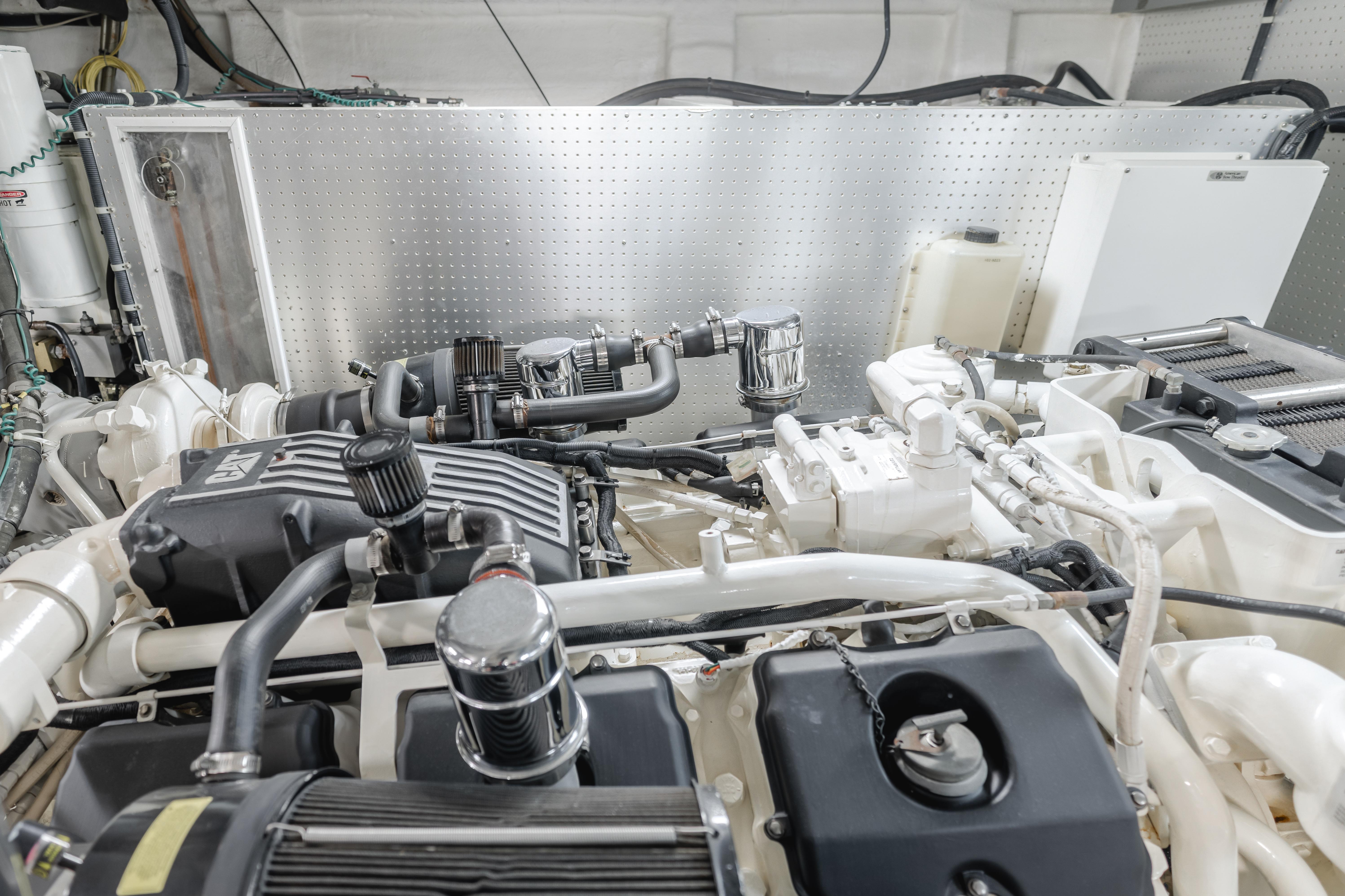 Engine room of a 2003 TransWorld CUSTOM boat with visible components and wiring.