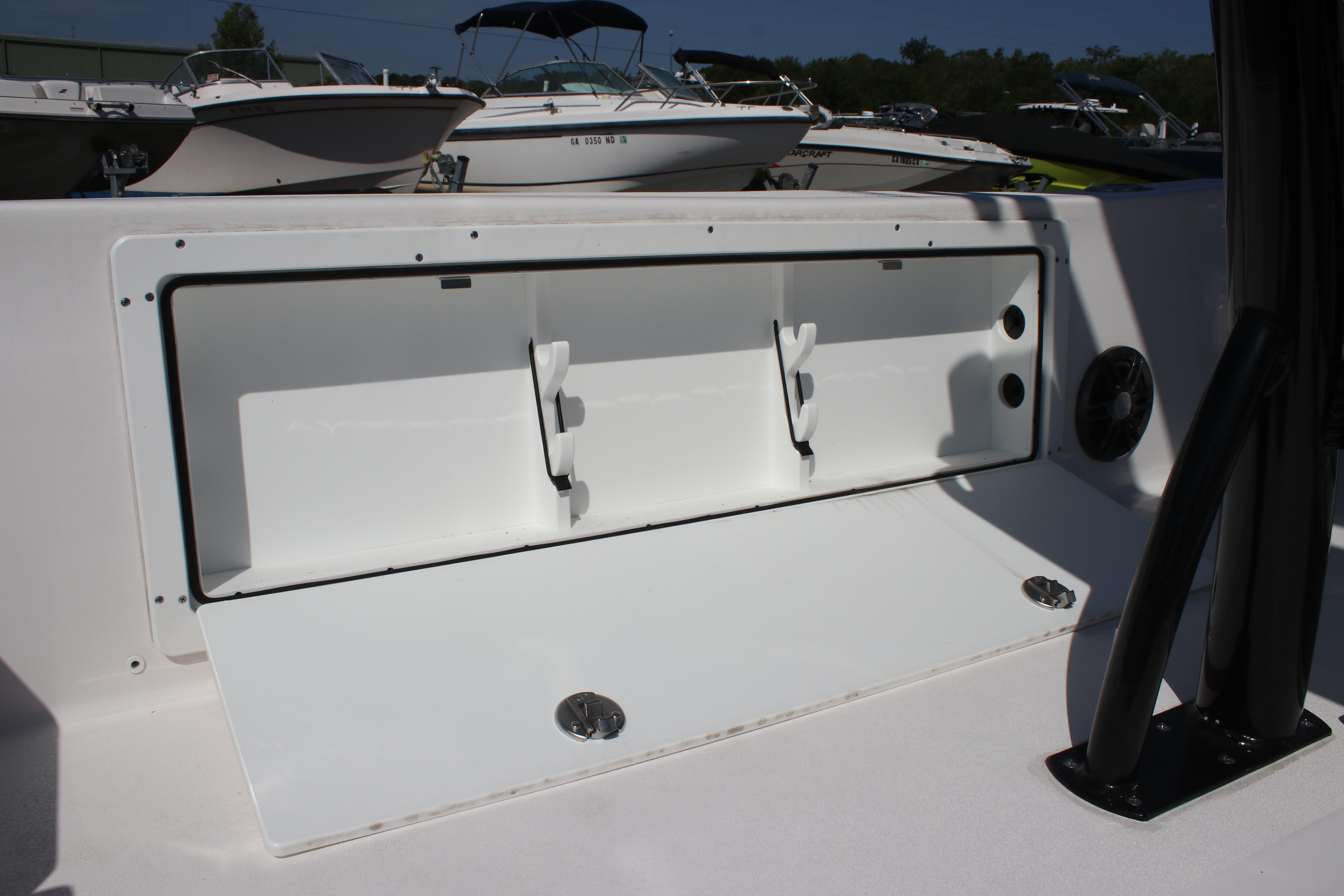 2025 Sea Fox 251 Bay Fox boat storage compartment open, showcasing interior space.