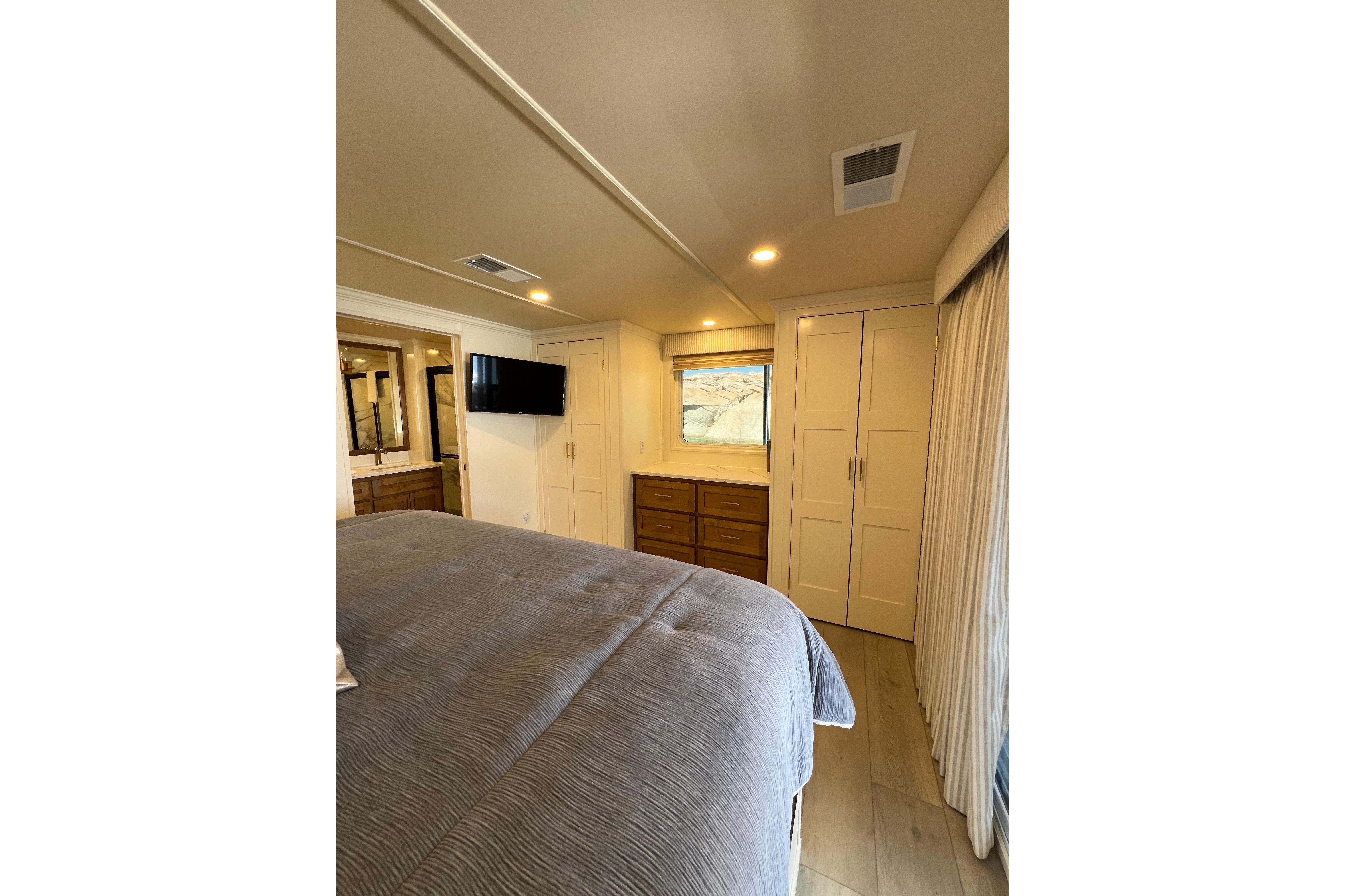 Luxurious bedroom interior in 2025 Sumerset Excellence Multiple Shares houseboat, featuring modern decor.