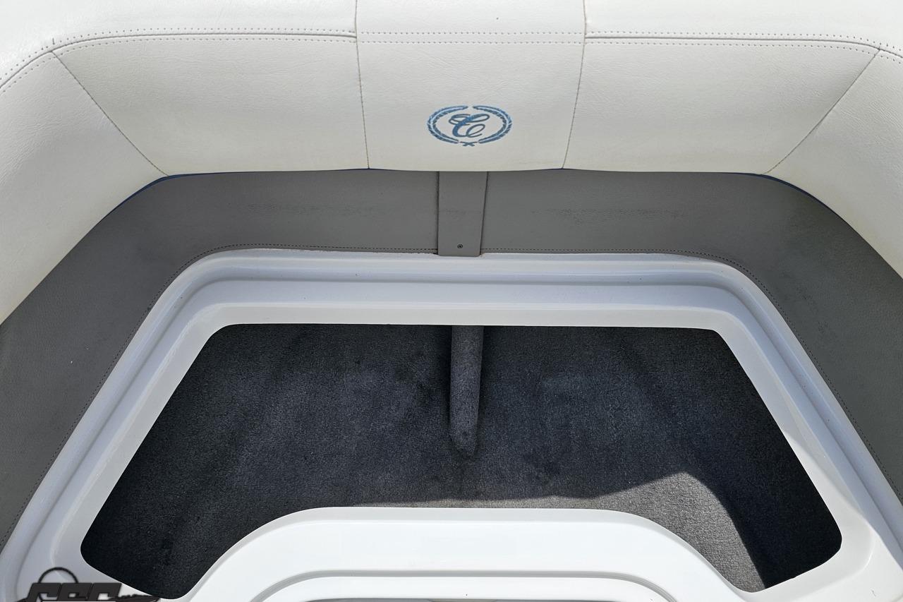 2010 Cobalt 232 WSS boat interior storage compartment with logo detail.