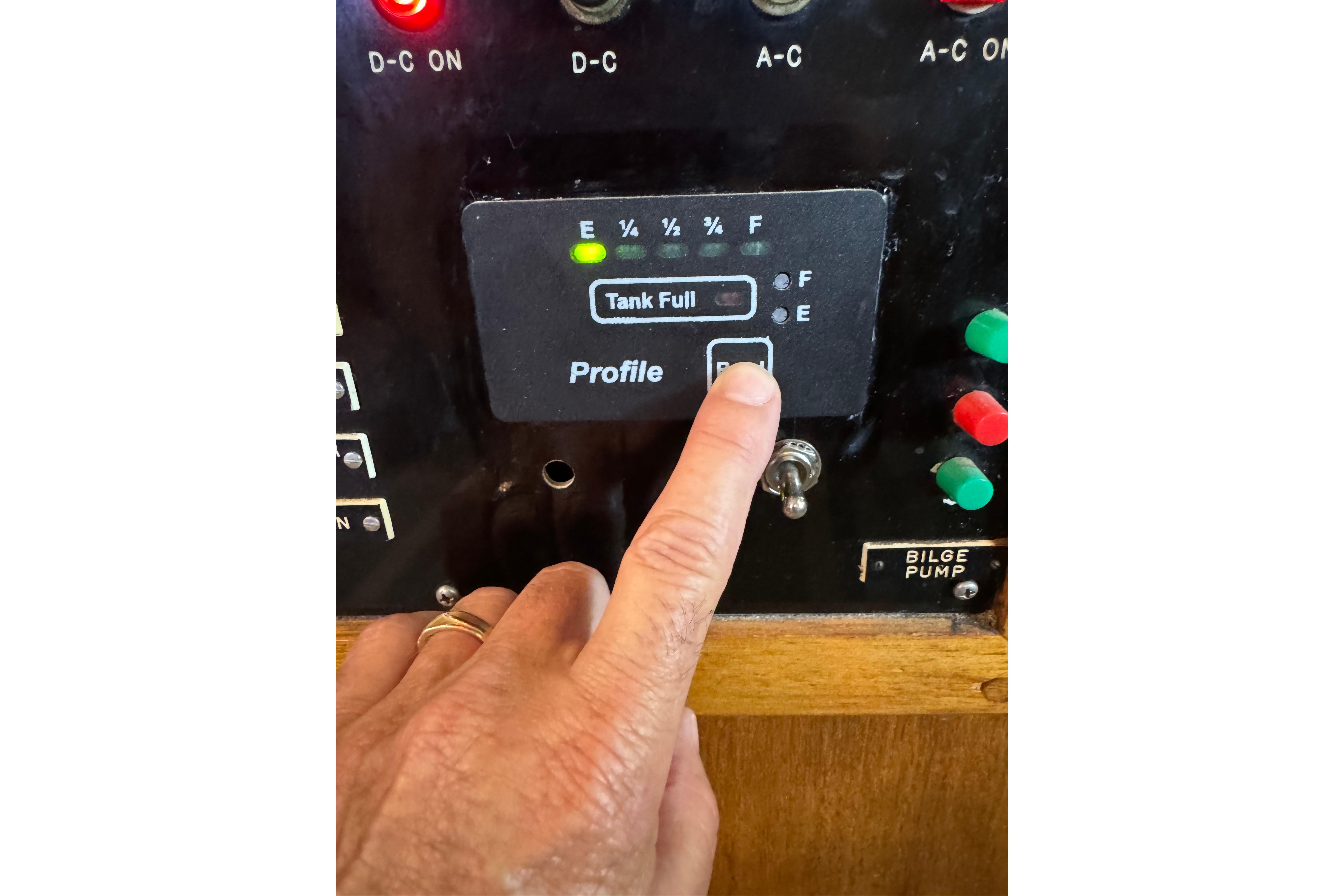 Control panel of a 1978 Californian 42 LRC boat with tank indicator.