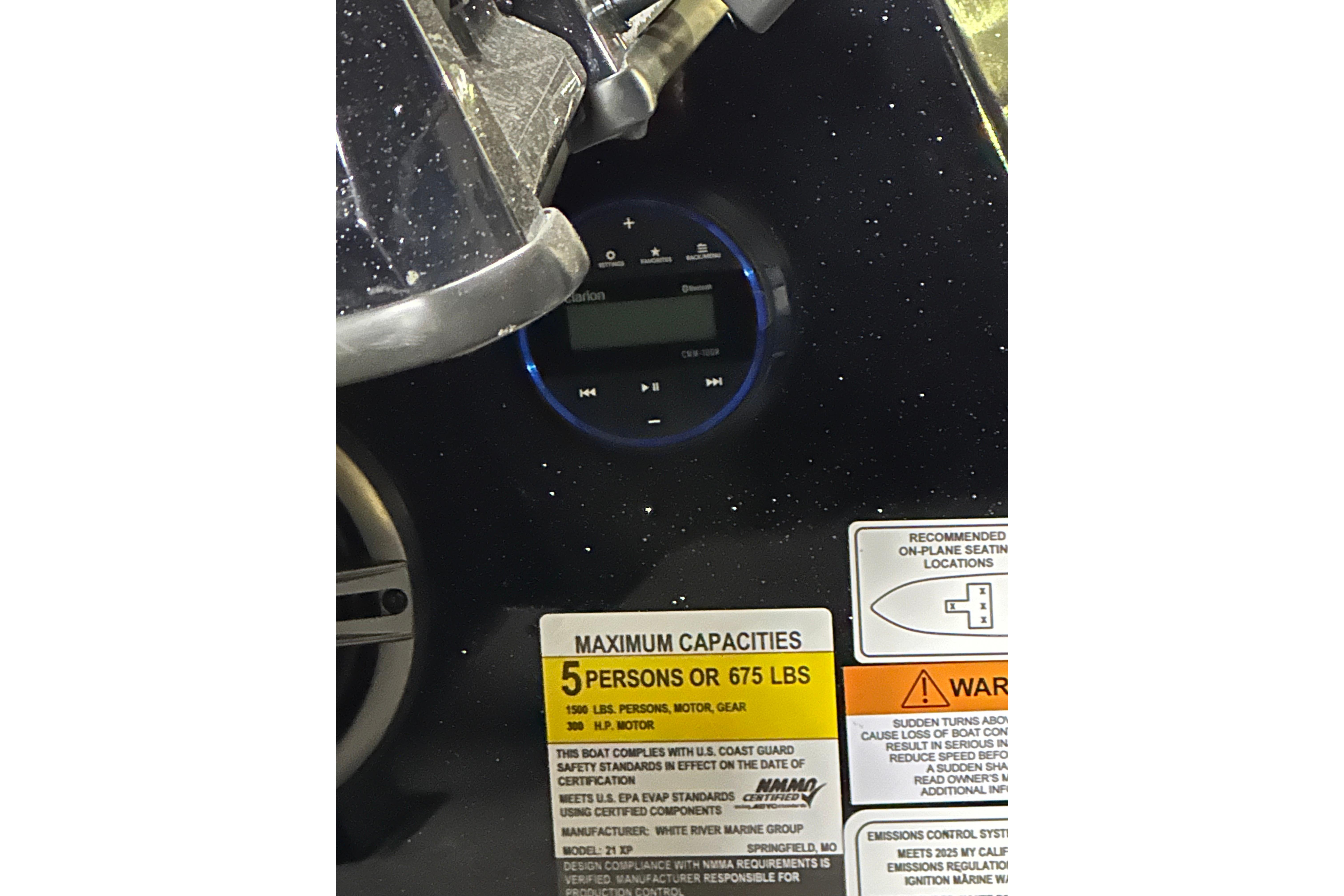 2025 Triton 21XP Patriot dashboard with capacity warning label and control panel.