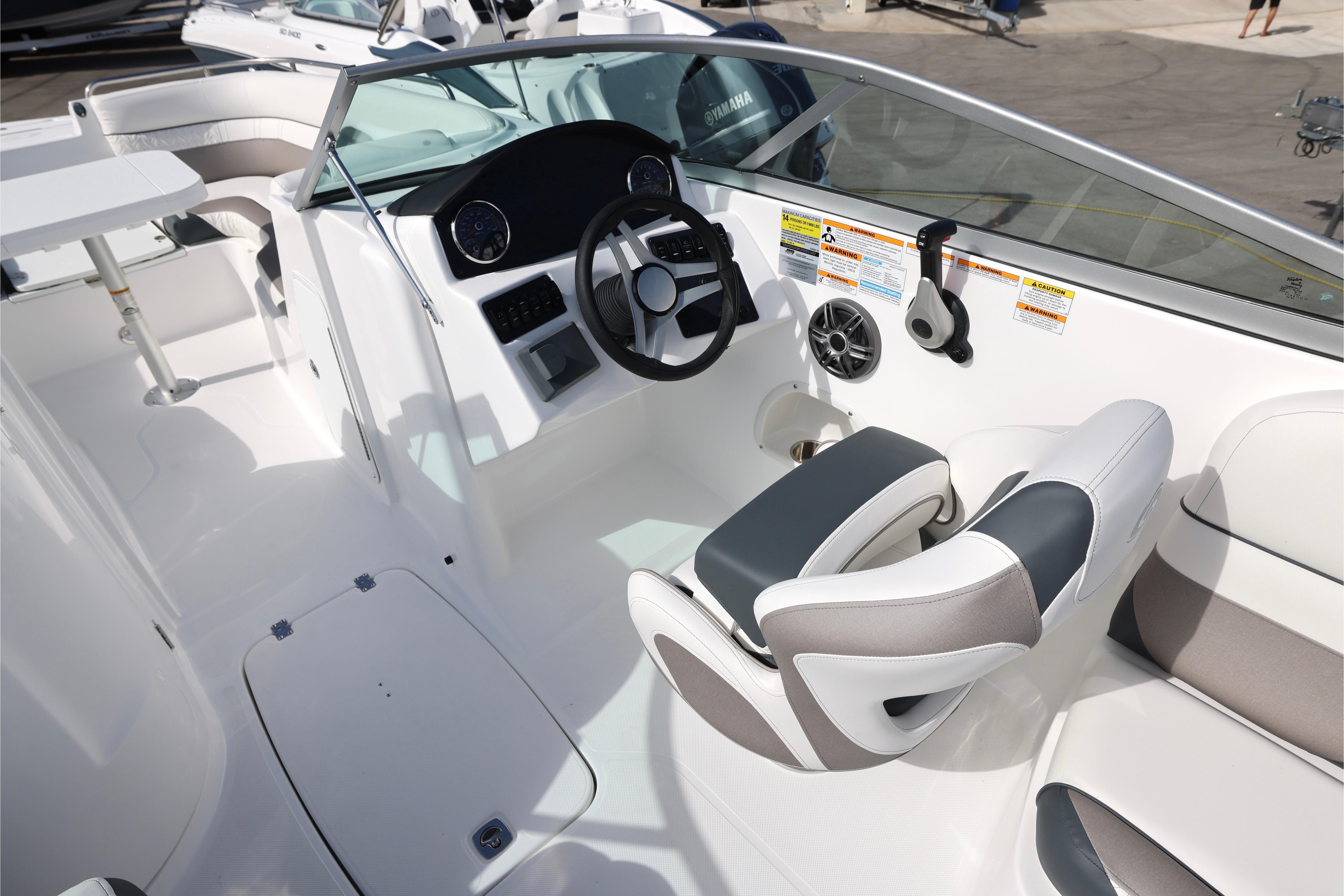 2026 Hurricane SunDeck 2486 OB boat interior with modern helm and seating.