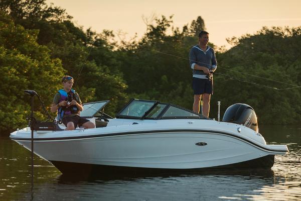 Manufacturer Provided Image: Two people fishing on a 2015 Sea Ray 19 SPX OB boat in a serene lake.