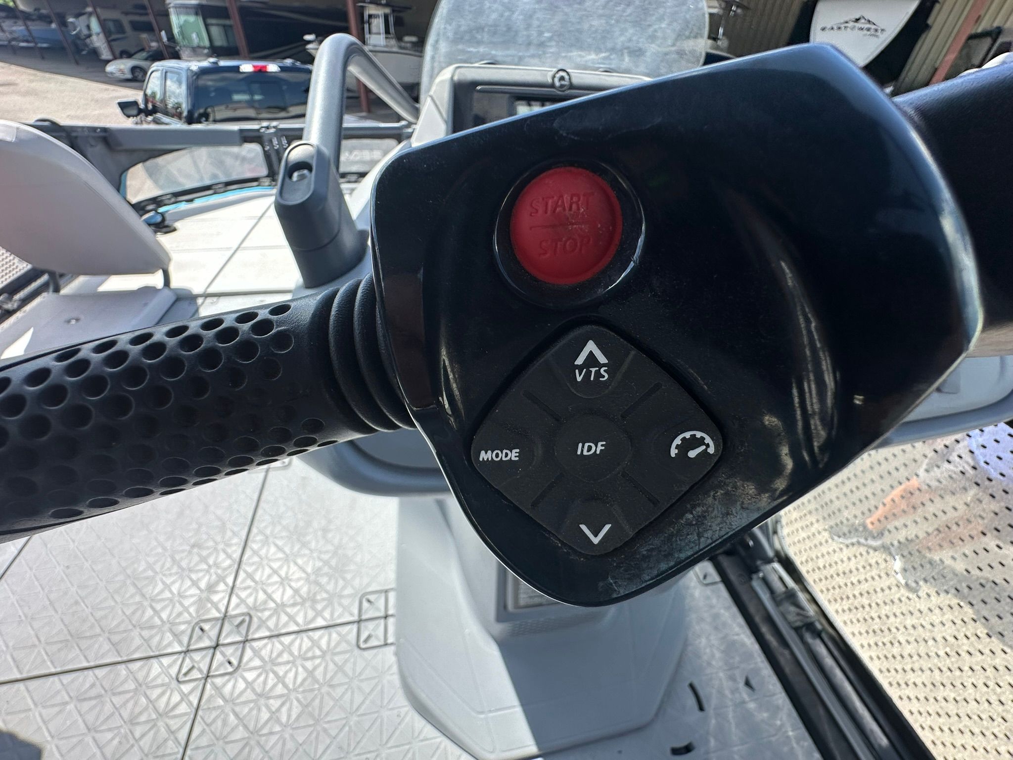 Close-up of a Sea-Doo 21 SWITCH SPORT handlebar with various controls.