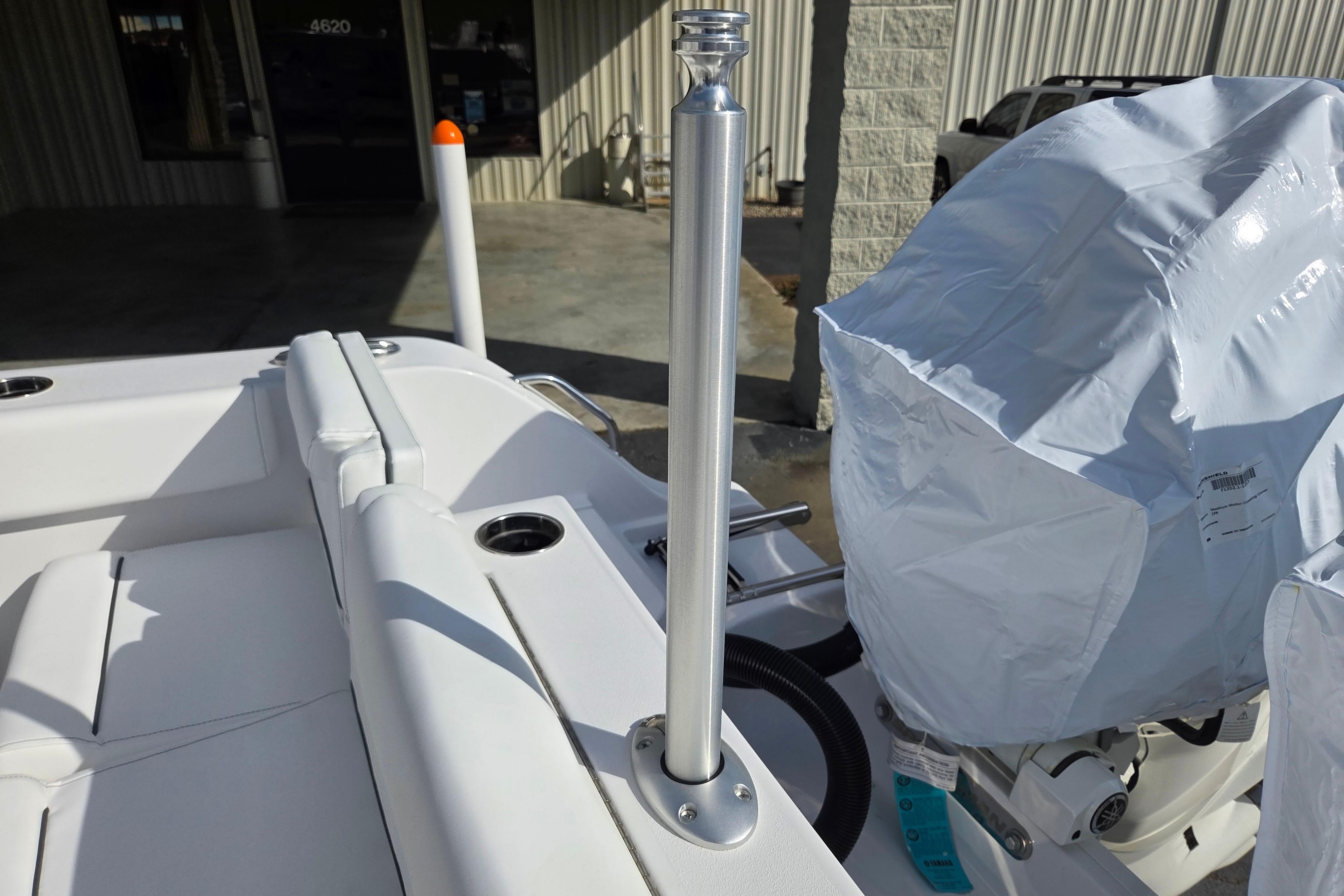 2026 Sportsman Heritage 261 Center Console boat interior with covered engine and seating.