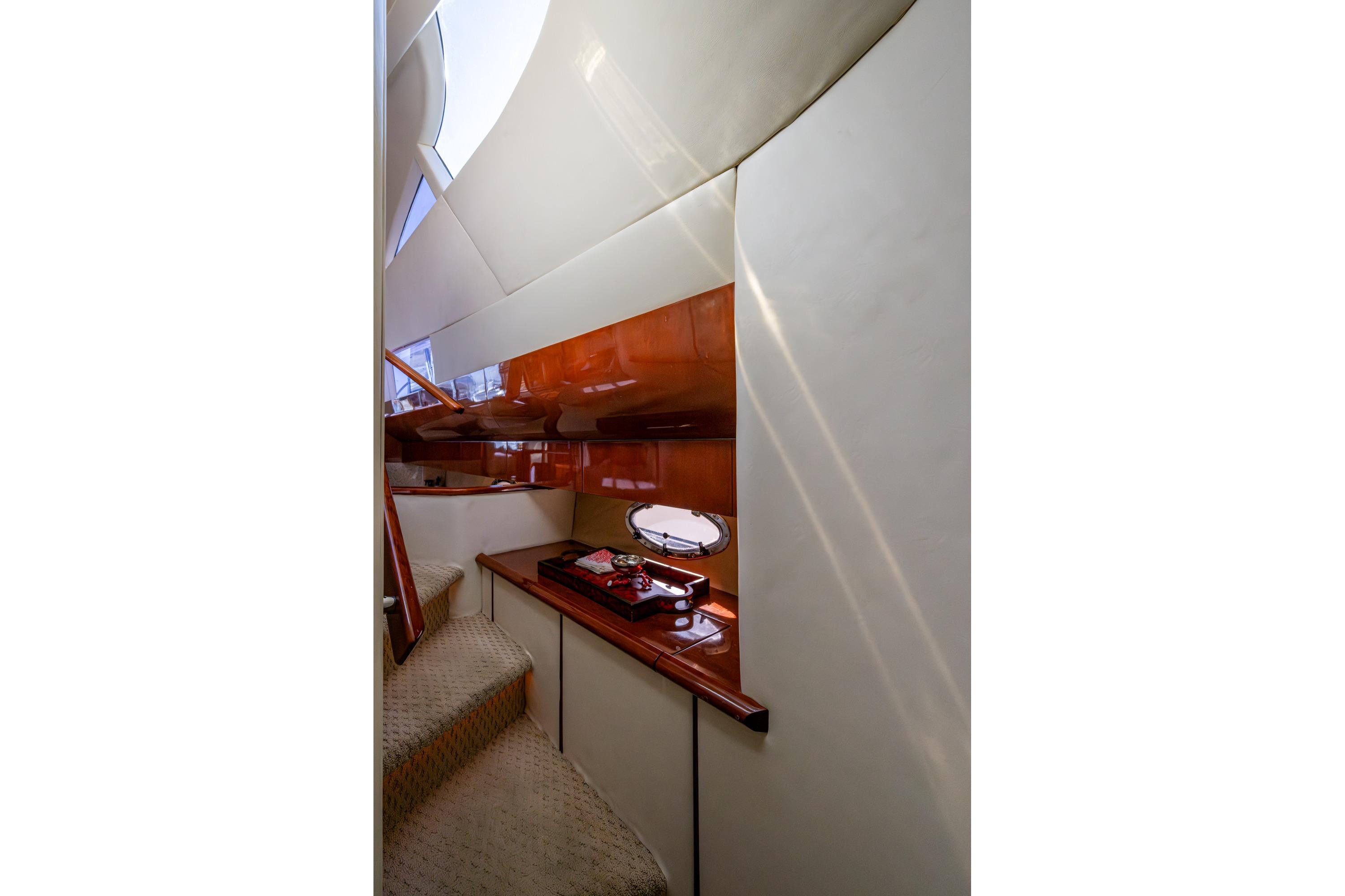 Luxurious interior of 2000 Fairline Squadron 52 yacht with elegant wood finishes.