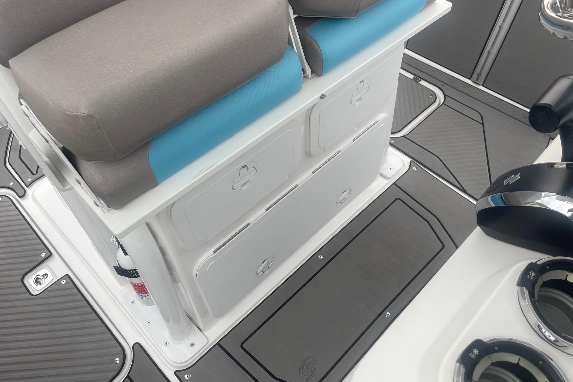 2025 Hurricane Center Console 24 OB boat interior with seating and storage compartments.