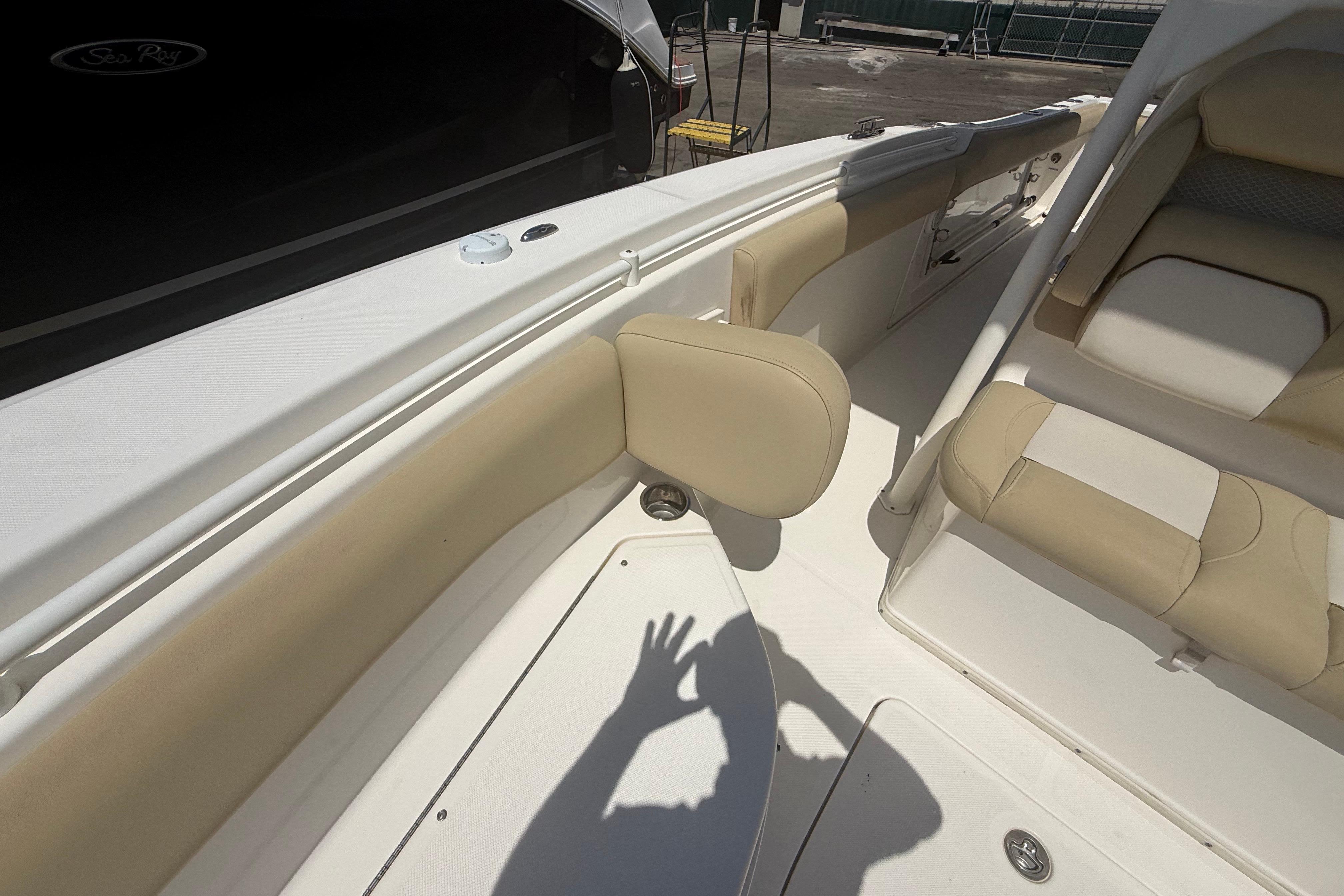 2019 Key West Billistic 281 Center Console interior with beige seating and white deck.