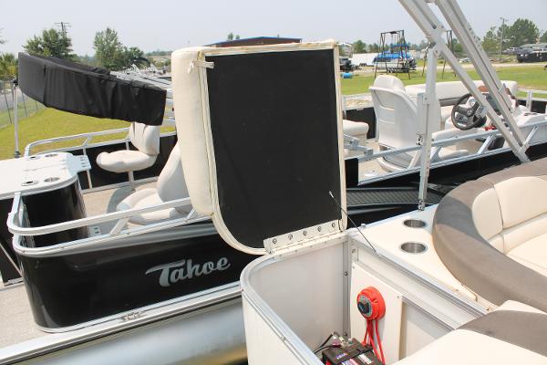 2021 Tahoe LTZ Cruise pontoon boat with seating and open storage compartment.