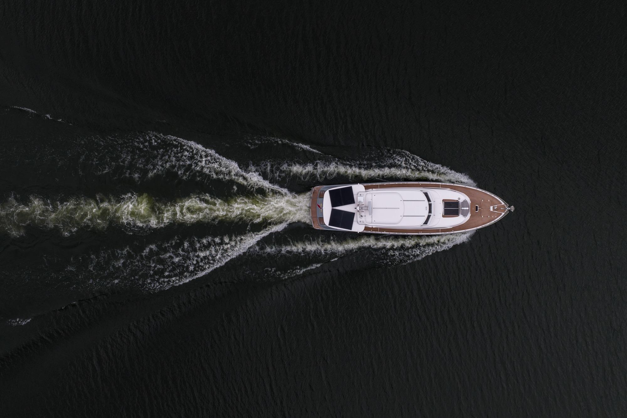 Aerial view of 2025 Elling E6 yacht cruising on dark water.