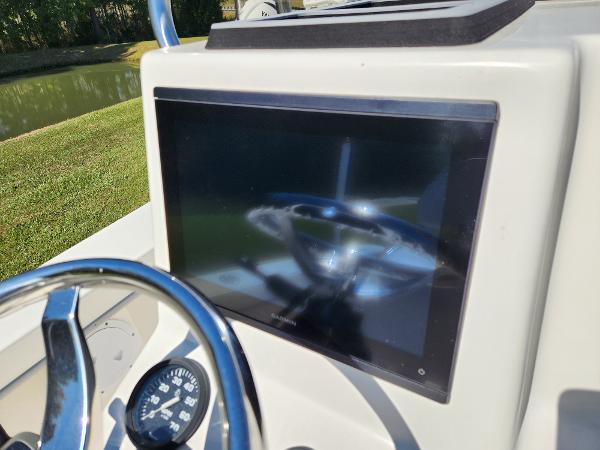 2023 May-Craft 208 CC boat dashboard with steering wheel and display screen.