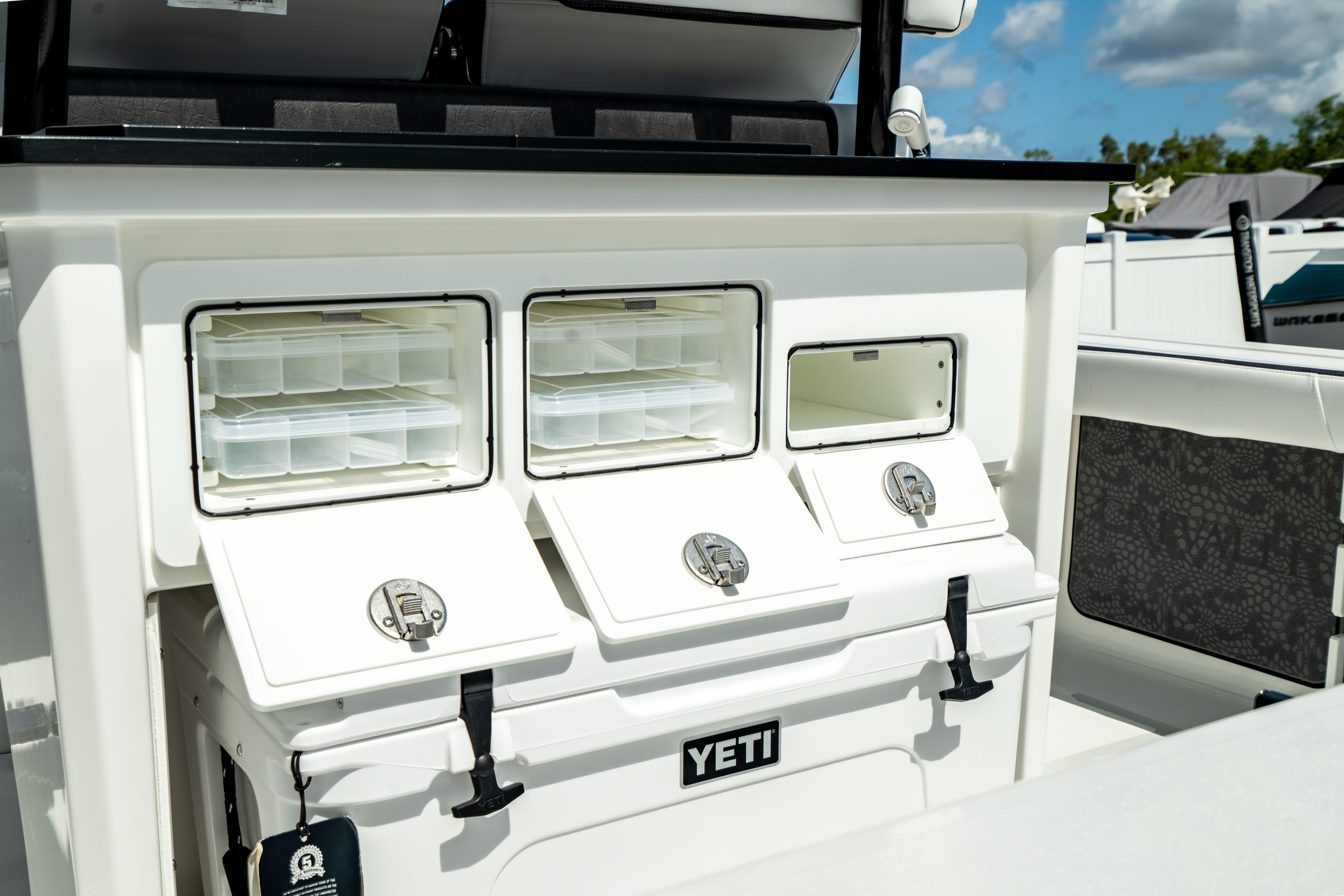 Crevalle 26 HBW 2025 boat with Yeti cooler and storage compartments.