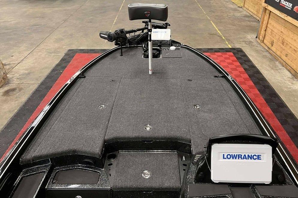 2026 Triton 20XP Patriot boat deck with Lowrance electronics and fishing equipment.