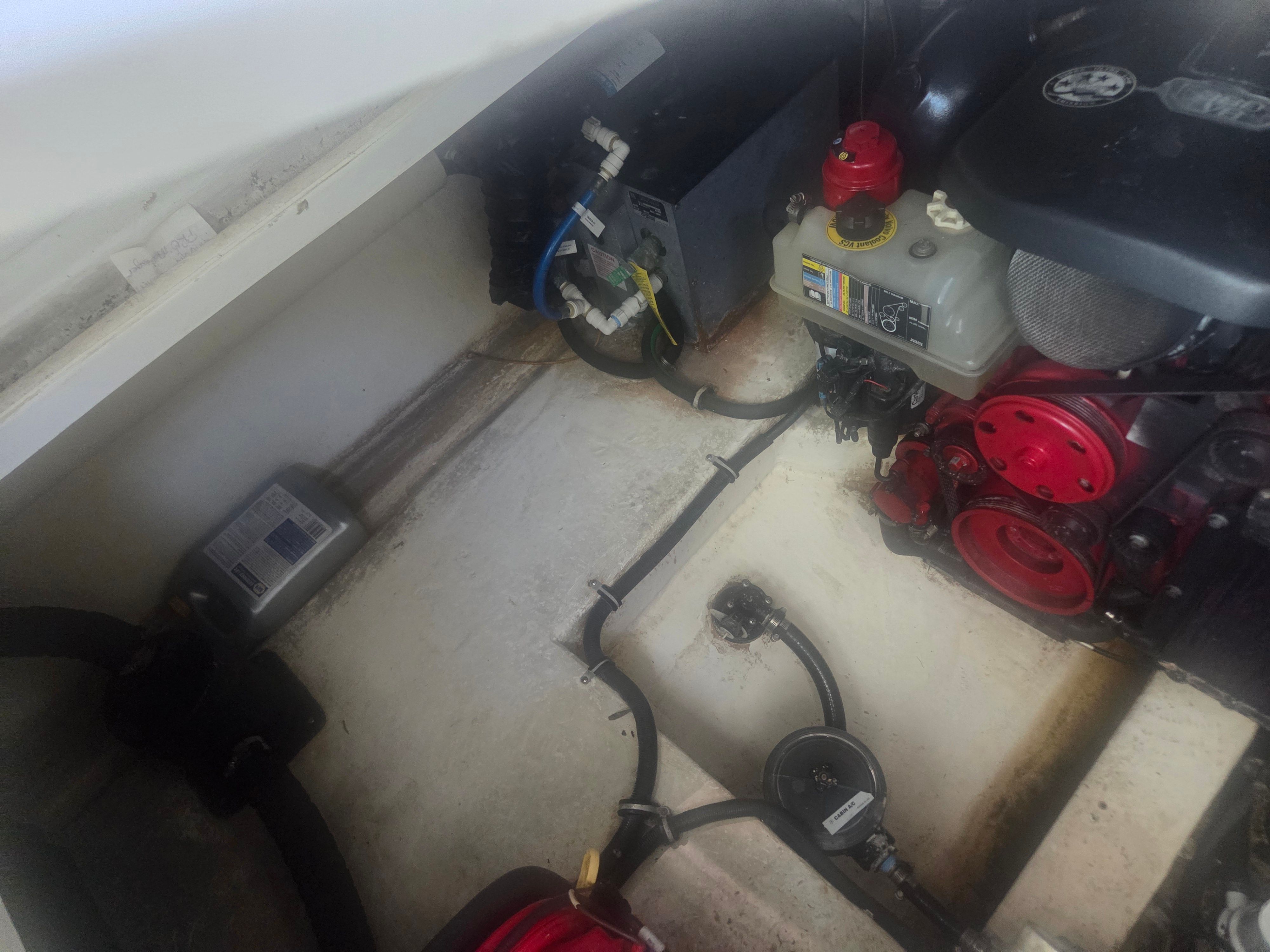 Engine compartment of a 2019 Monterey 360SC boat with visible components.