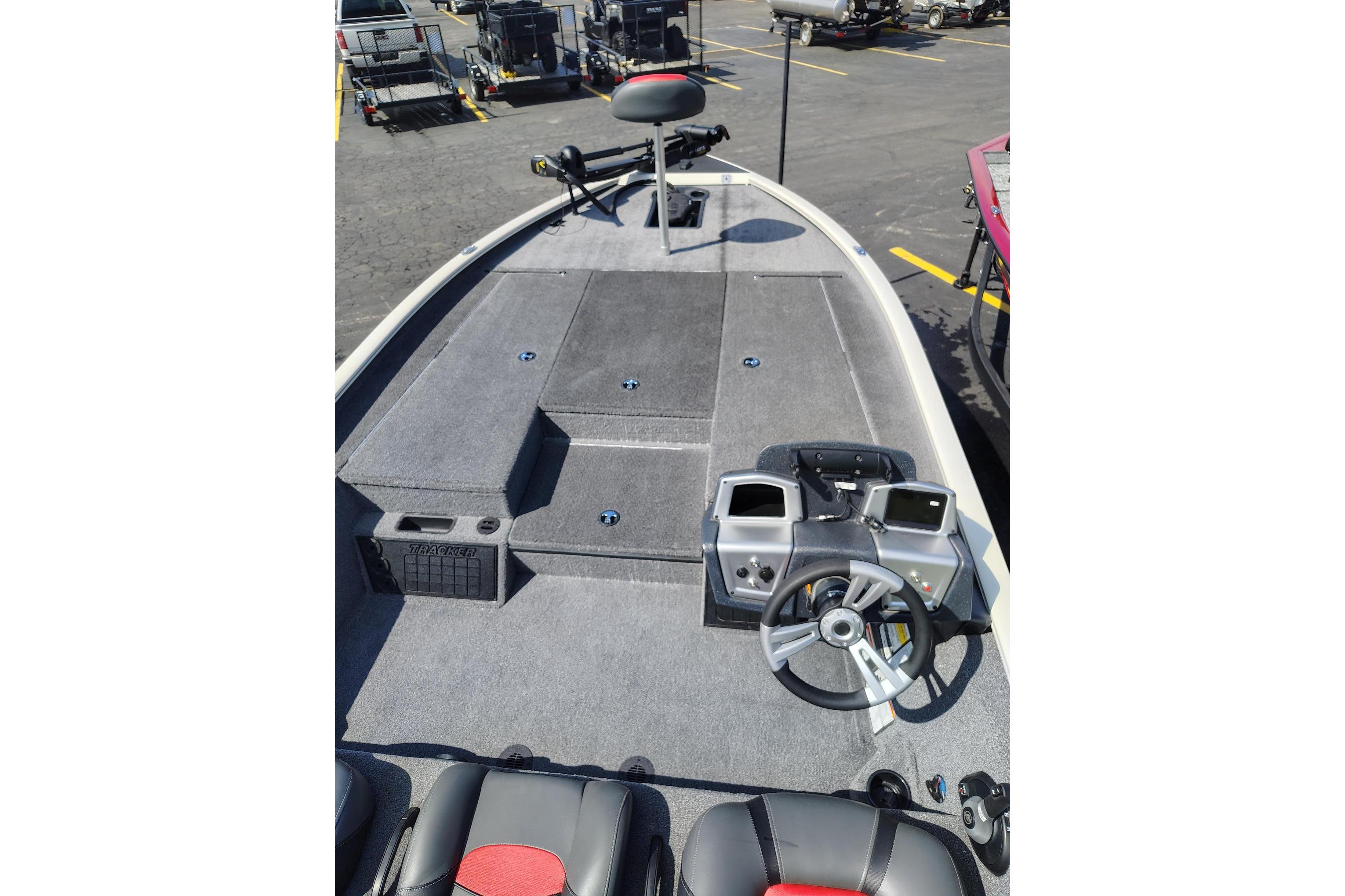 2025 Tracker Savage 215 boat interior with steering wheel and control panel.