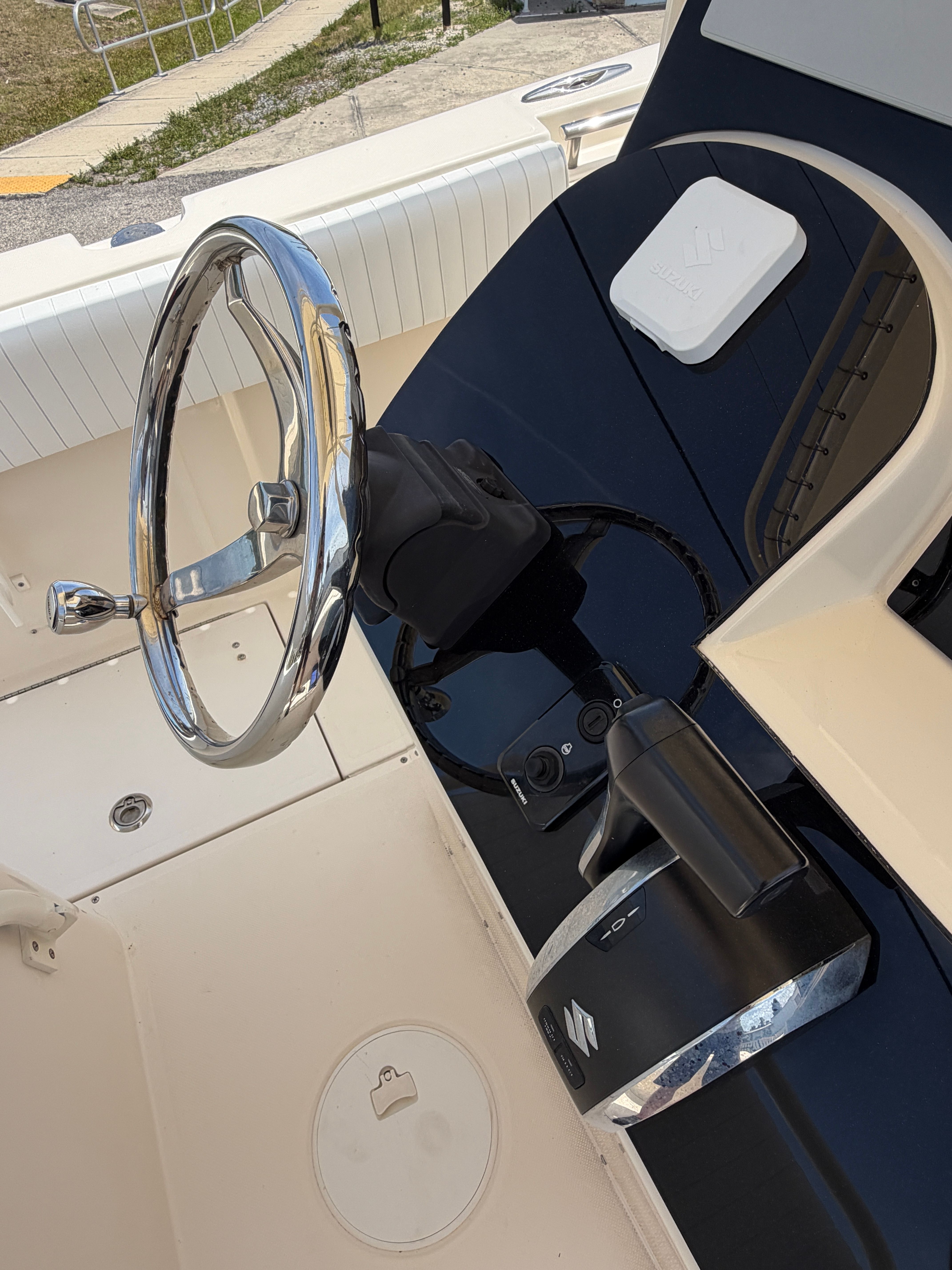 Steering console of a 2004 McKee Craft 24 FREEDOM boat.