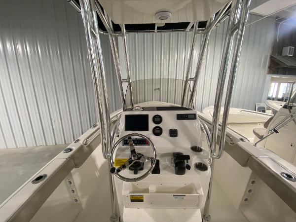 2024 Key West 203 FS boat console with steering wheel and controls.