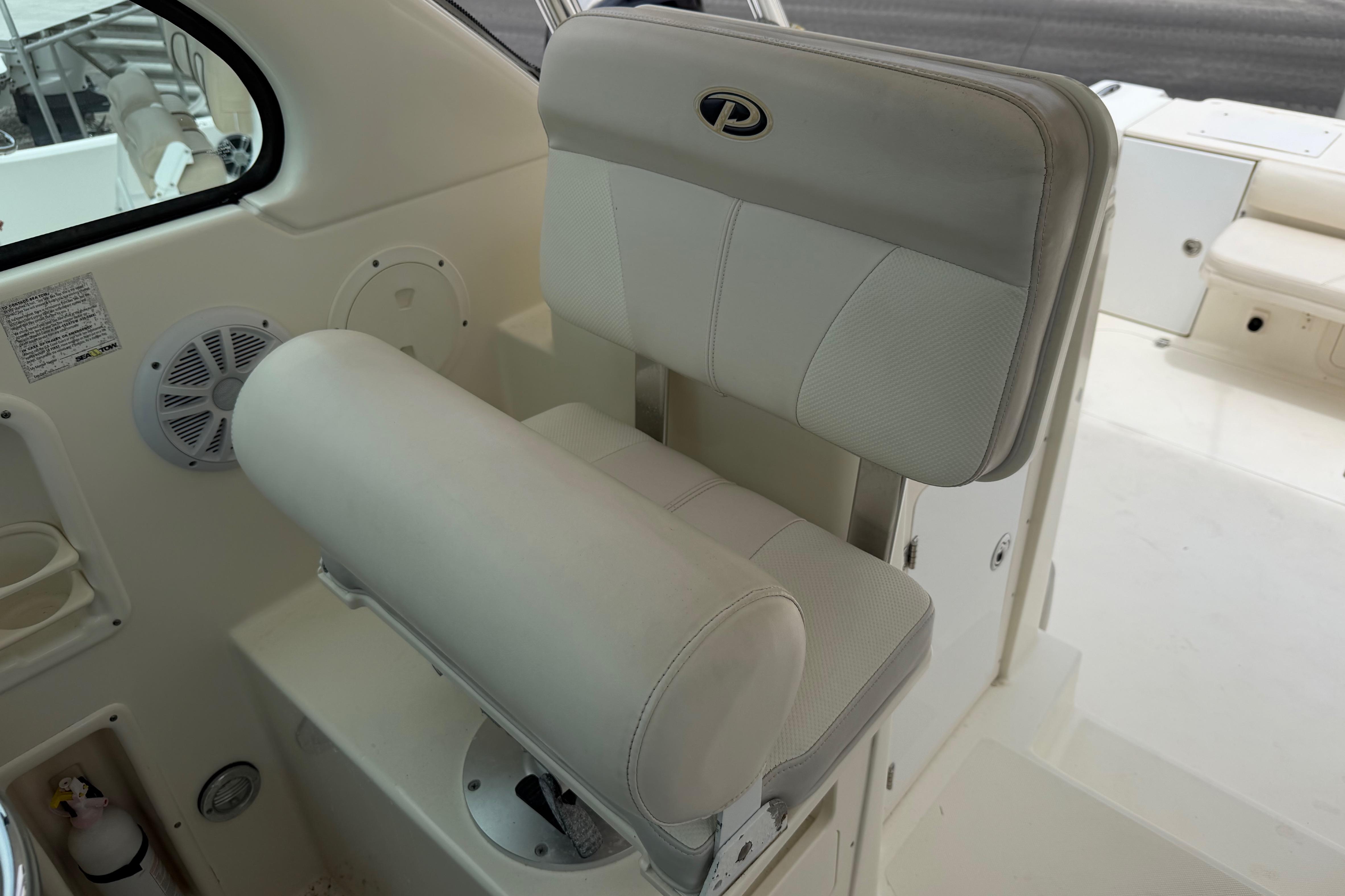 2008 Pursuit OS 335 Offshore boat seat with logo, featuring white upholstery.